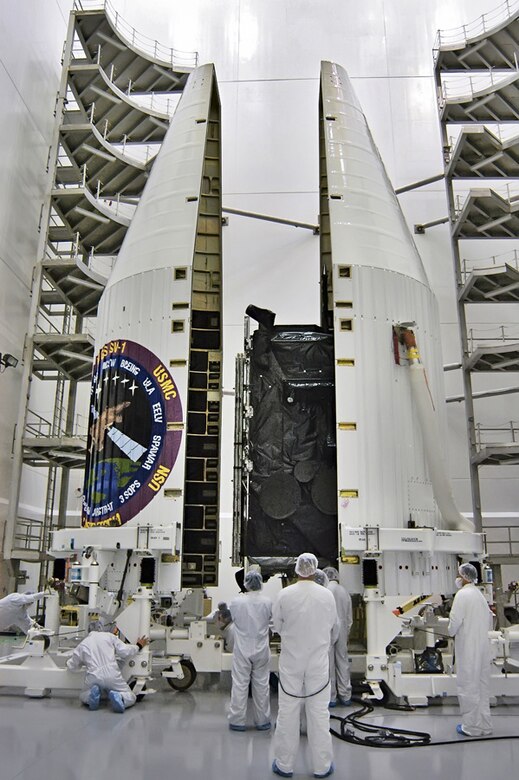 Assembly of the Wideband Global SATCOM Satellite took place at Boeing corporation facilities in California. Here, the satellite is being enclosed within the nosecone of the rocket that carried it into orbit. (Photo courtesy Boeing Corp.)
