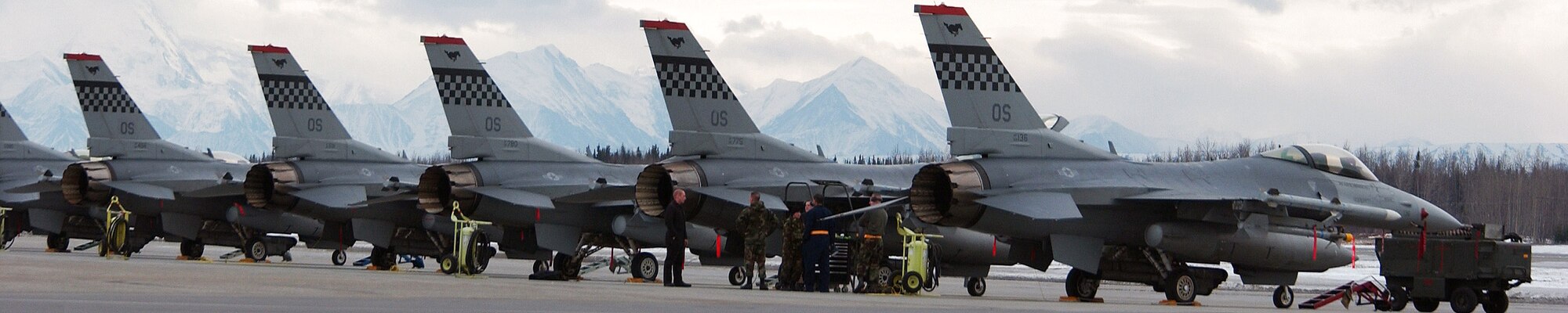 F-16 Fighting Falcons sit on the tarmac late into the evening April 1 at Eielson Air Force Base, Alaska. Aircraft gathered together for Red Flag-Alaska 08-2. These aircraft are assigned to the 36th Fighter Squadron, Osan Air Base, Korea. (U.S. Air Force photo/Airman 1st Class Jonathan Snyder) 
