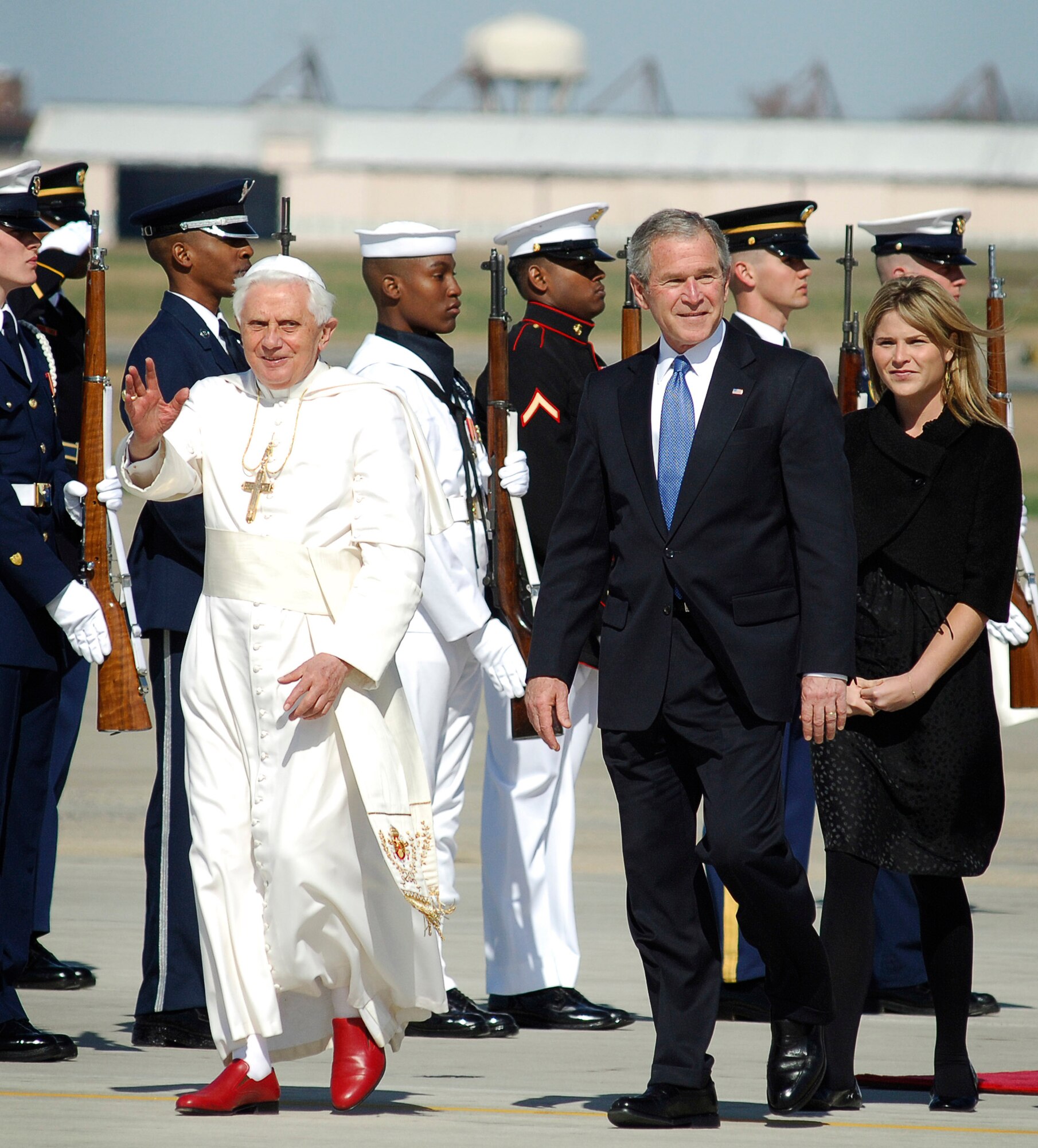 Pope Benedict XVI talks to President George W. Bush upon his arrival as he is escorted past a joint honor guard April 15 at Andrews Air Force Base, Md. The pope is visiting the United States for a week and will meet with President Bush at the White House, address the presidents of Roman Catholic colleges and universities, and celebrate Mass at Nationals Park in Washington, D.C., and Yankee Stadium in New York City. The pontiff was selected as the 265th pope on April 19, 2005. (U.S. Air Force photo/Tech. Sgt. Suzanne M. Day)
