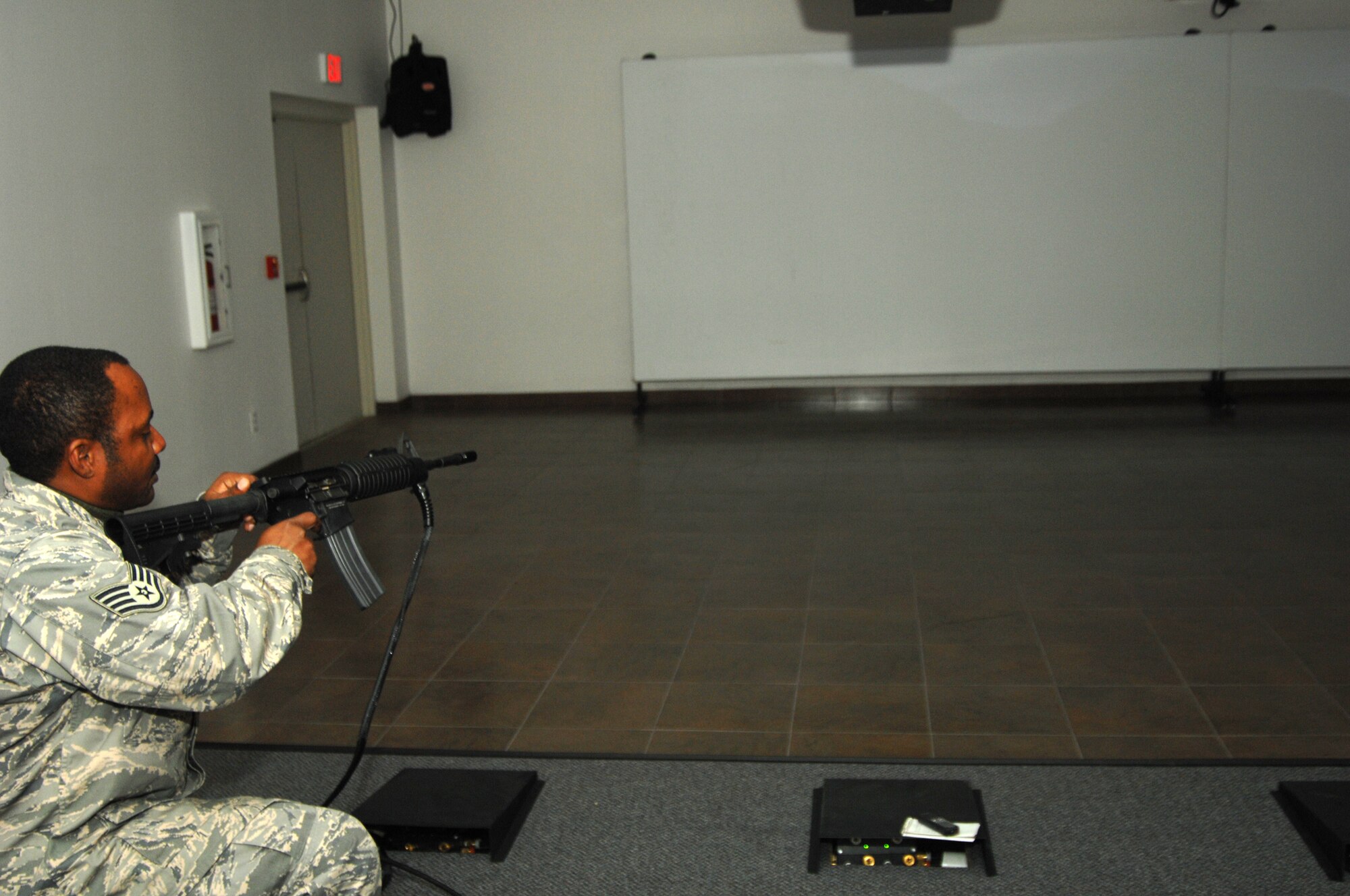 MOUNTAIN HOME AIR FORCE BASE, Idaho -- Staff Sgt. James Parker, 366th Security Forces Squadron combat arms instructor, practices his marksmanship on the Engagement Skills Trainer 2000 facility, a computer-operated indoor weapons training simulator system, April 10. The simulator gives security forces Airmen a chance to gain combat experience from the safety of their home station. (U.S. Air Force photo/ Senior Airman Megan P. Lyon)