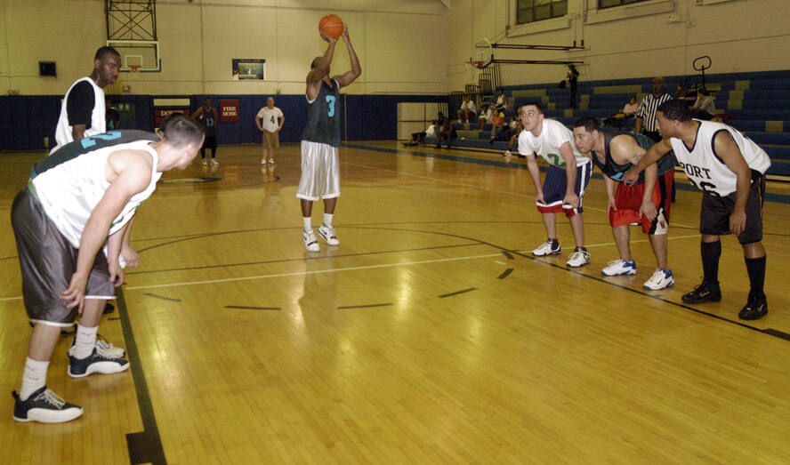 Maurice Pitts, 436th Operations Support Squadron, shoots a free throw during the intramural basketball game against the 436th Aerial Port Squadron April 10 at the Fitness Center. (U.S. Air Force photo/Airman 1st Class Shen-Chia Chu)