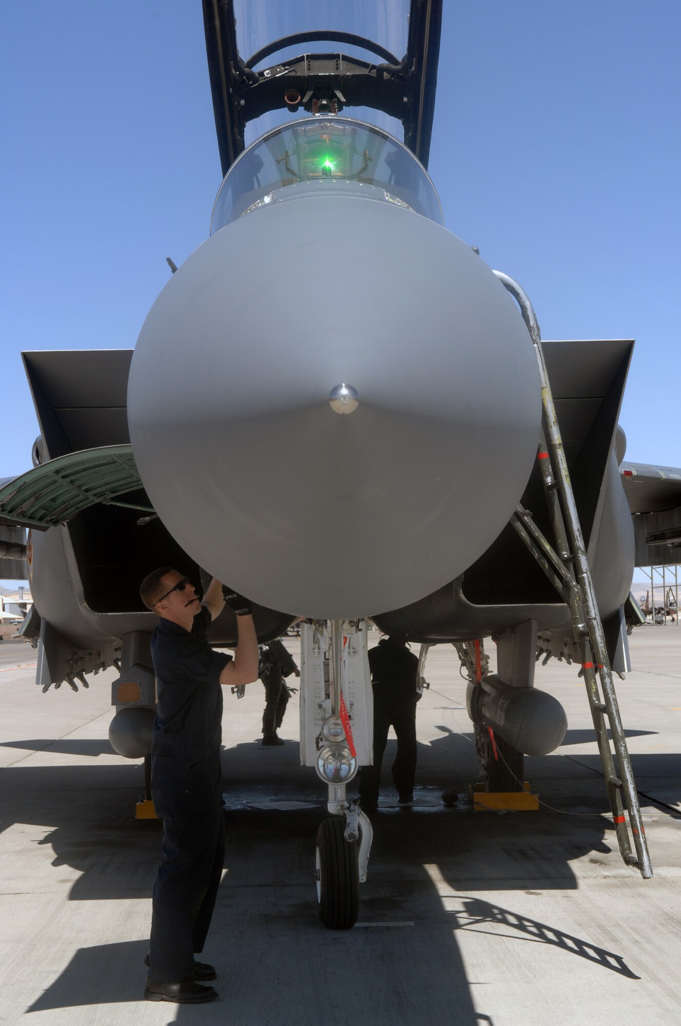MOUNTAIN HOME AIR FORCE BASE, Idaho -- Staff Sgt. Mark Rouintree, 391st Aircraft Maintenance Unit dedicated crew chief, conducts a routine post-flight inspection of an F-15E Strike Eagle after it returned from a training mission April 9 at Nellis AFB, Nev. The 391st Fighter Squadron is at Nellis until May 2 to provide support for aircrews training at the United States Air Force Weapons School. The 366th Fighter Wing supports the weapons school every two years. (U.S. Air Force Photo/ Airman 1st Class Brian Ybarbo)