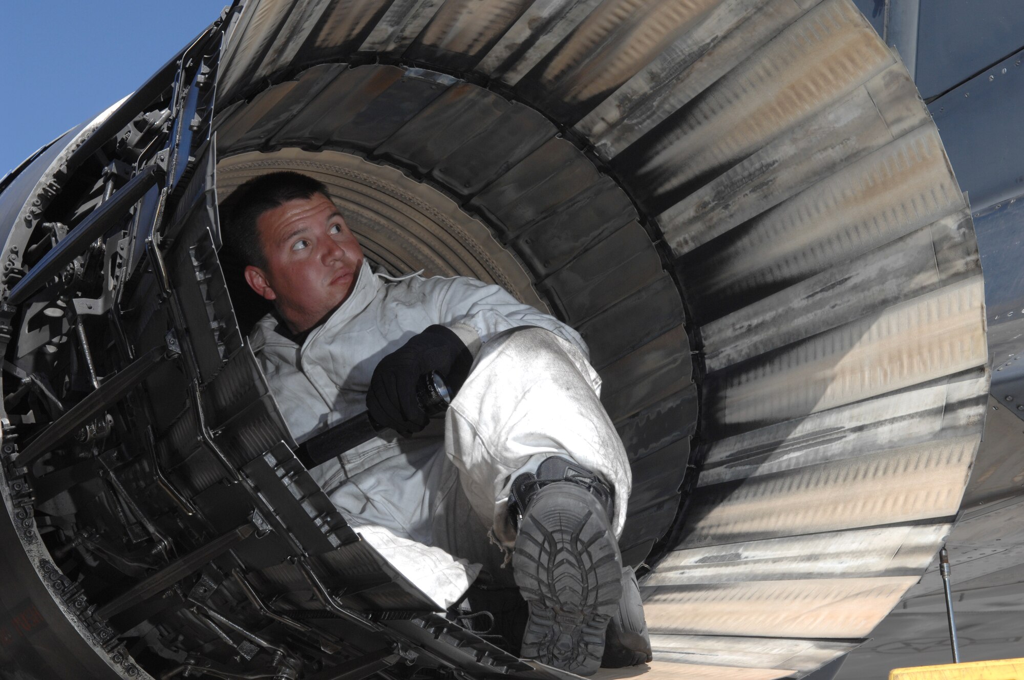 MOUNTAIN HOME AIR FORCE BASE, Idaho -- Staff Sgt. Charles Sparks, 391st Aircraft Maintenance Unit dedicated crew chief, inspects the intake and exhaust of an F-15E Strike Eagle, after it returned from a training mission April 9 at Nellis AFB, Nev. The 391st Fighter Squadron is at Nellis until May 2 to provide support for aircrews training at the United States Air Force Weapons School. The 366th Fighter Wing supports the weapons school every two years. (U.S. Air Force Photo by/ Senior Airman Larry E. Reid Jr.)