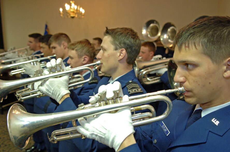 Cadet 4th Class Andrew Cutler, Air Force Academy Drum and Bugle Core soprano trumpet player, plays the Star Spangle Banner at the 28th Force Support Squadron activation ceremony at Dakota's on April 11. The FSS represents a merger between the 28th Services Squadron and 28th Mission Support Squadron, which were deactivated prior to the FSS stand-up. (U.S. Air Force photo/Senior Airman Marc I. Lane) 