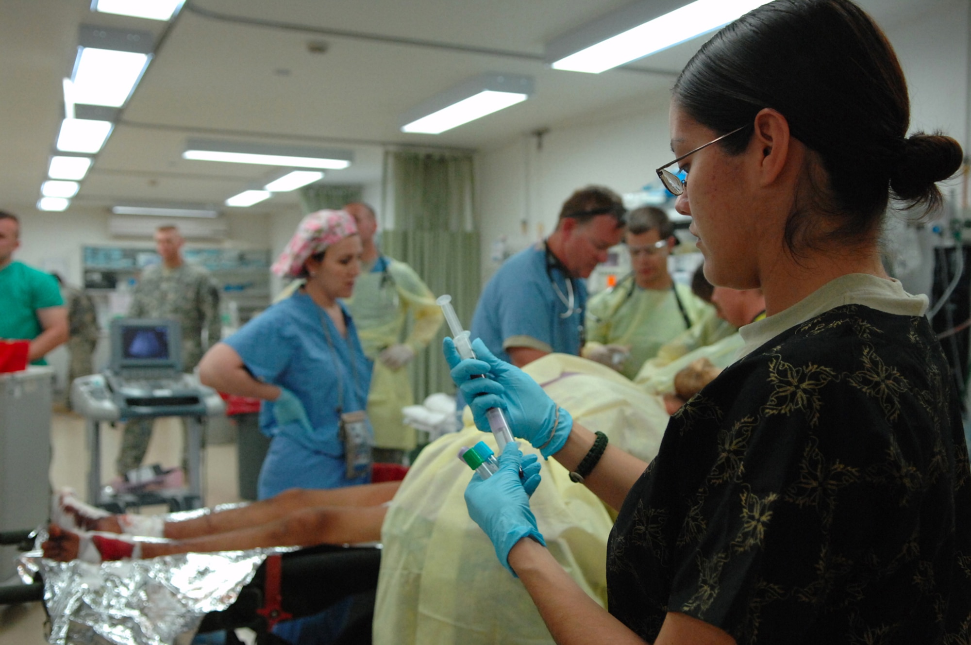 BALAD AIR BASE, Iraq -- Senior Airman Nina Valdez, 332nd Expeditionary Medical Group laboratory technician, prepares a blood sample taken from an Iraqi patient at the Air Force Theater Hospital here, April 15. The patient was transported, along with nine other injured Iraqi adults, to the AFTH, after a vehicle-borne improvised explosive device exploded in Baquba. Thirty-five Iraqi citizens were killed and 66 injured in the explosion. The attack was the first suicide bomber attack in the region in nearly three months. Airman Valdez is deployed from Keesler Air Force Base, Miss. (U.S. Air Force photo /Senior Airman Julianne Showalter)