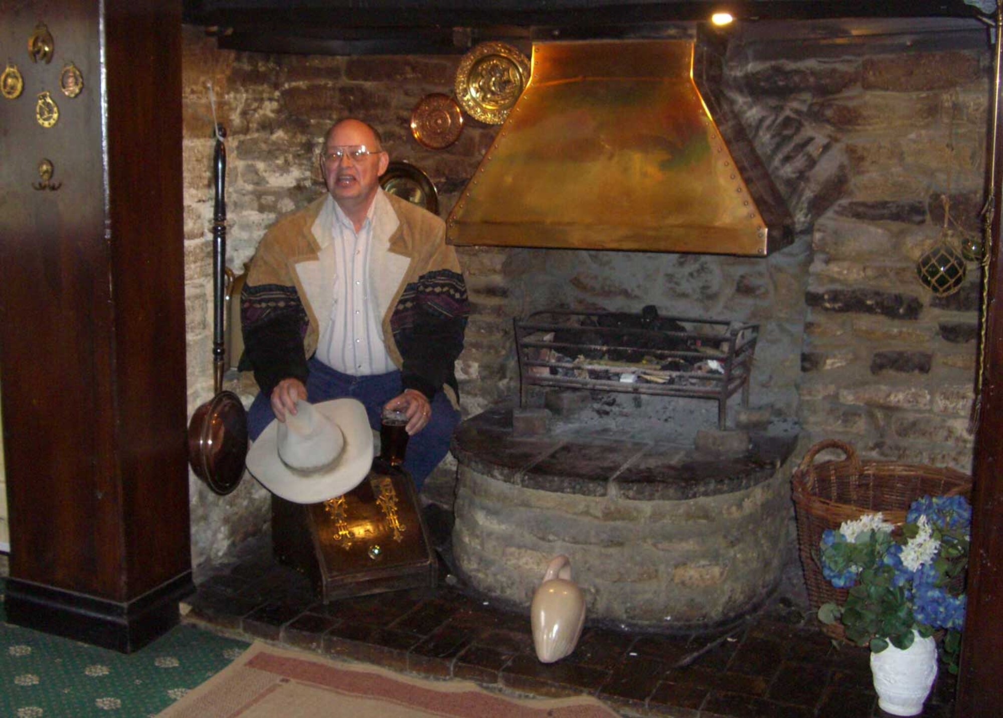 Mr, Jerry Carter reprises the position that his father, then Staff Sgt. Edward K. Carter would assume on a cold night at the White Swan public house near RAF Molesworth the wartime base of the 303rd Bomb Group to which Staff Sgt. Carter was assigned during WWII. (U.S. Air Force Photo by Peter Park)