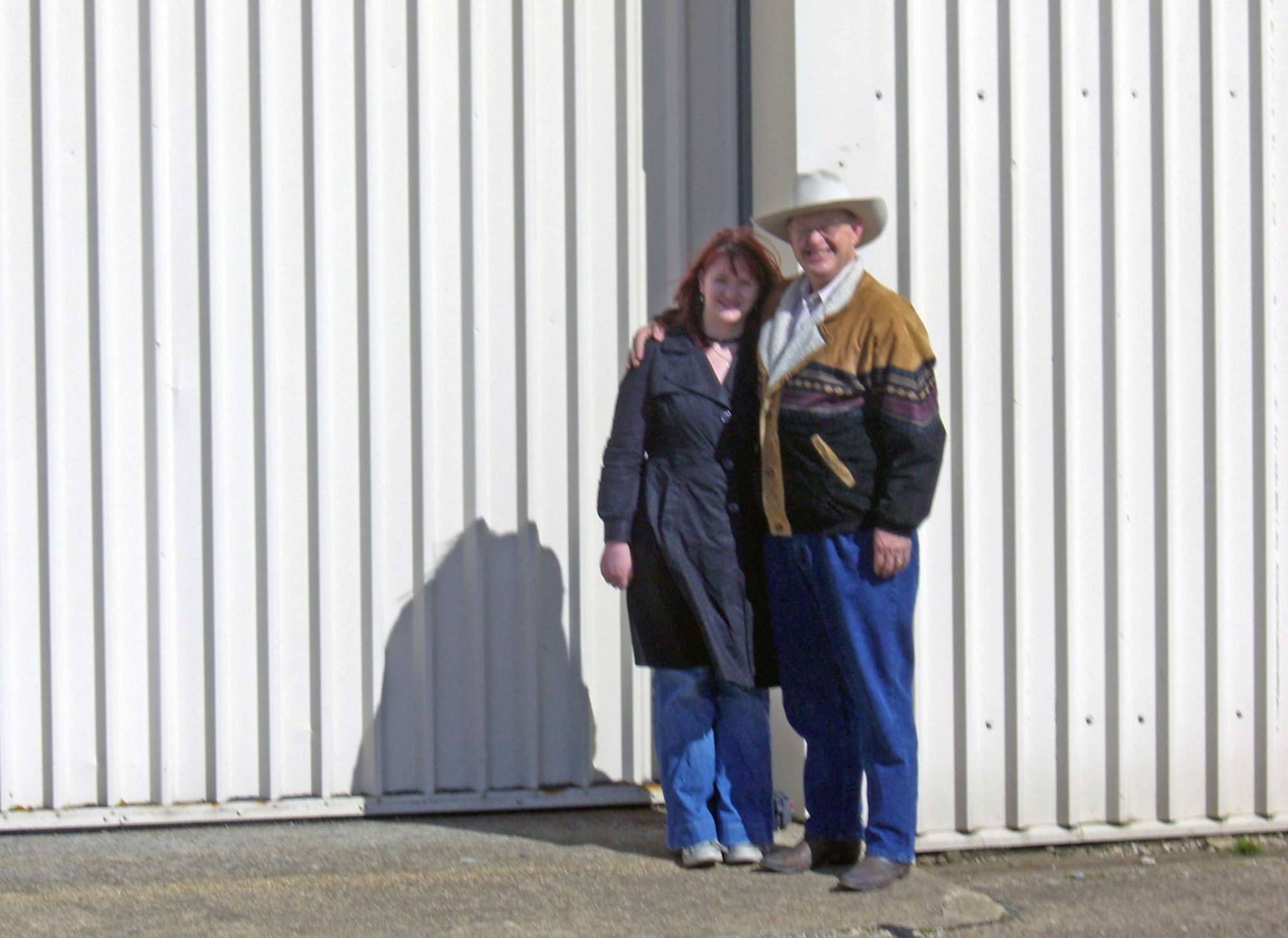 Mr. Jerry Carter and his daughter Alison stand on the spot where in July 1943 the comedian Bob Hope presented a USO show at Molesworth -- then the home of the 303rd Bomb Group (Heavy)  Attending the show that day was Mr. Carter's father, then Staff Sgt. Edward K. Carter.  See accompanying photo of the show.  U.S. Air Force photo by Peter Park)