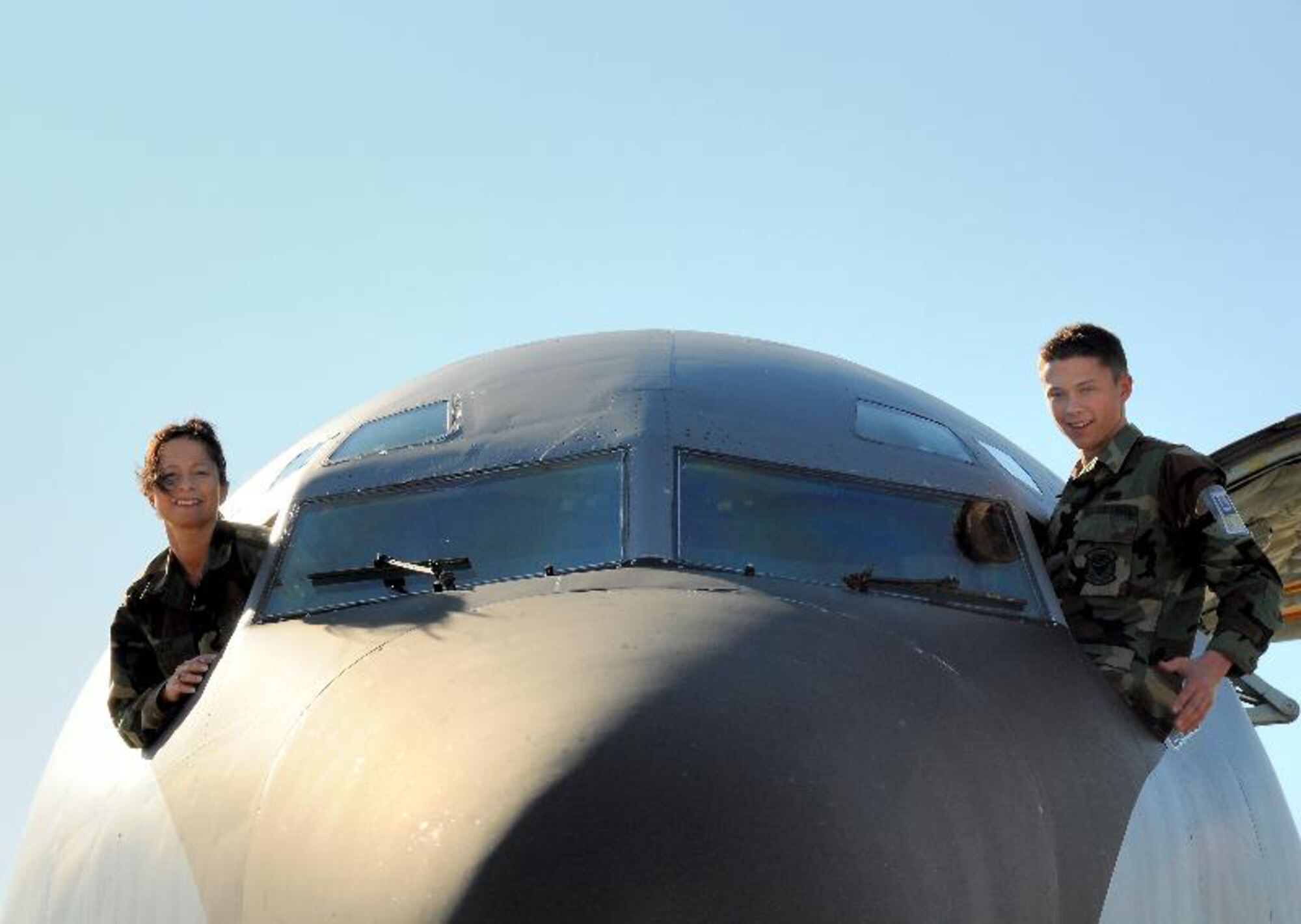 SEYMOUR JOHNSON AIR FORCE BASE, N.C. -- Master Sgt. Susan Pate, and son, Senior Airman Andy Pate, take a quick look out of a KC-135R. Both are reservists with the 916th Maintenance Group.  U.S. Air Force photo/Master Sgt. John Payne