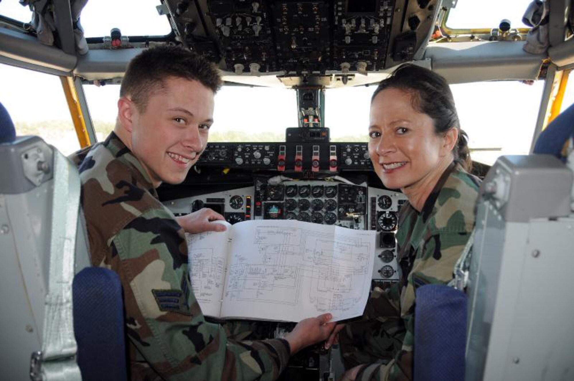 SEYMOUR JOHNSON AIR FORCE BASE, N.C. -- Senior Airman Andy Pate shows his mom, Master Sgt. Susan Pate, a few things in the cockpit of a KC-135R tanker. Both are members of the 916th Maintenance Group and joined the Air Reserve Wing in 2006. U.S. Air Force photo/Master Sgt. John Payne