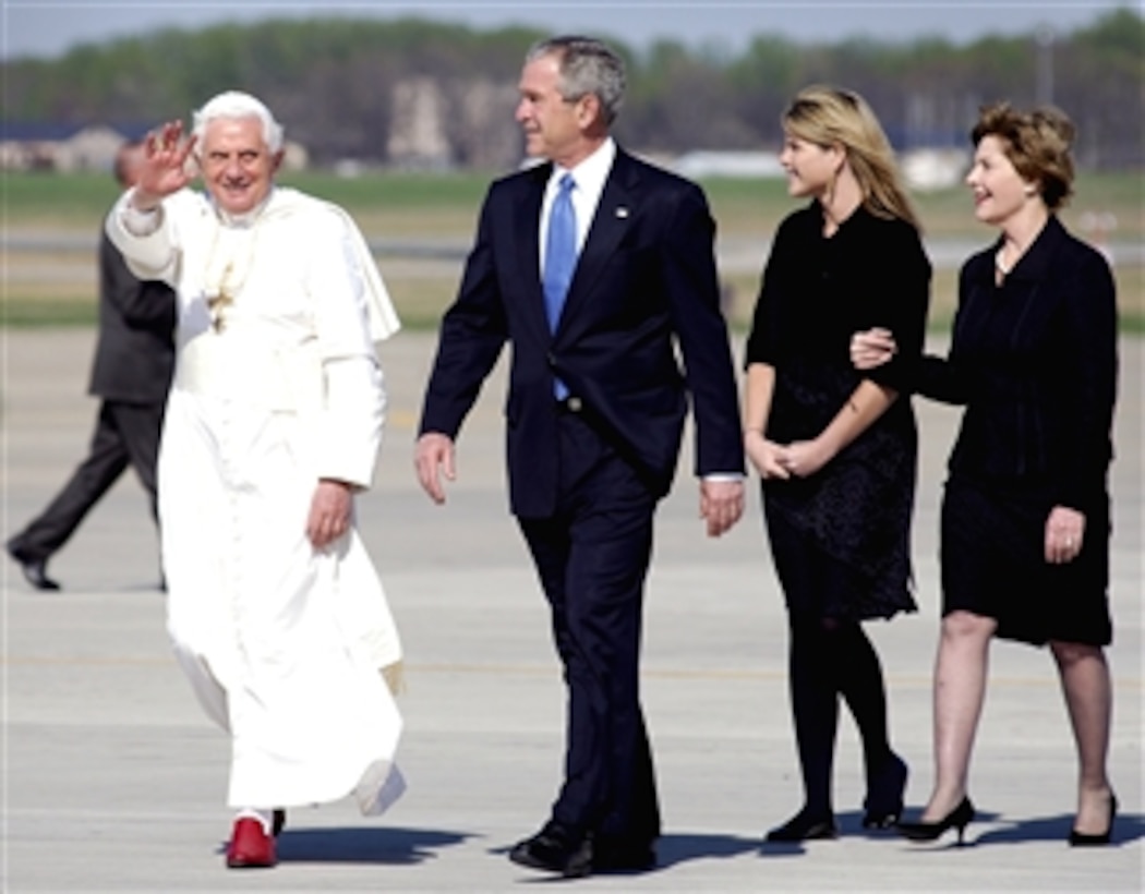Pope Benedict XVI waves to the crowd after he is greeted by President George W. Bush, Laura Bush, right, and their daughter, Jenna Bush, on Andrews Air Force Base, Md., April 15, 2008, at the start of his six-day trip to the United States. The Pope will meet with Bush at the White House and celebrate Mass at the Nationals Park in Washington, D.C.  