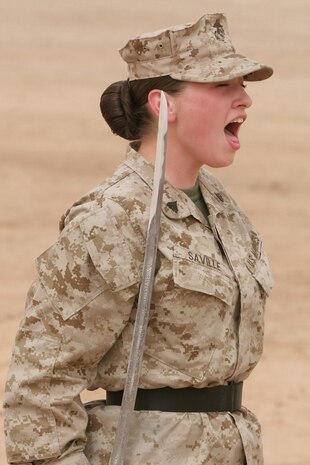 Cpl. Chantel Saville,20, logistics clerk, Headquarters Company, Regimental Combat Team 5, yells out a command during the drill portion of RCT-5â??s corporals course April 16 at Camp Ripper, Iraq.  Nineteen corporals from 15 different military occupational specialties trained for 10 days to become better noncommissioned officers.