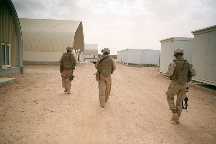 Marines with Task Force Mustang, 2nd Light Armored Reconnaissance Battalion, Regimental Combat Team 5, patrol through a future Iraqi compound in western Anbar province, Iraq, April 16. Task Force Mustang is on watch 24-hours a day, ensuring the safety of the workers and structure if the compound.  The compound will be the new home for Light Infantry Battalion, 4th Iraqi Army Brigade, 7th Iraqi Army Division.