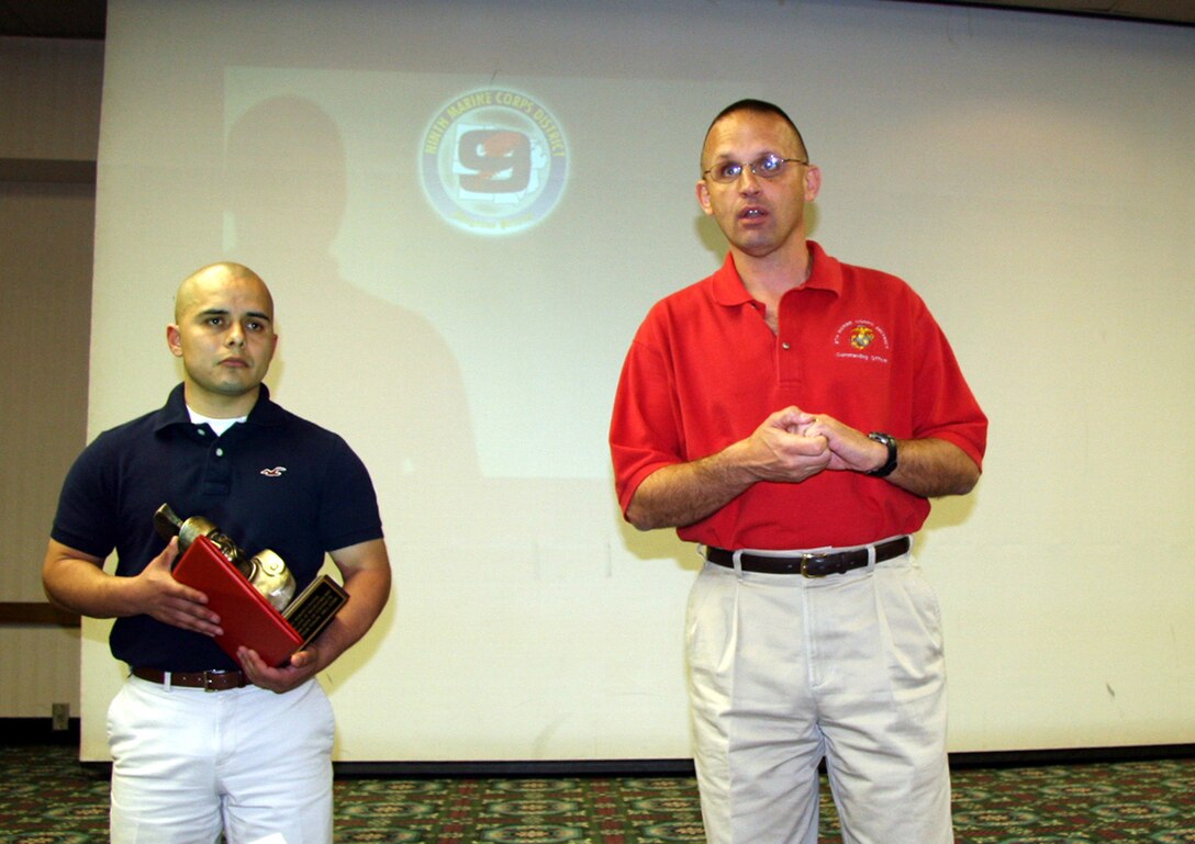 9th Marine Corps District Commanding Officer Col. Jeffery Peterson addresses the Marines during RS Lansing's Centurion award ceremony April 18. Staff Sgt. Roberto Rivera (left), staff noncommissioned officer in charge of Recruiting Substation Grand Rapids North, received the award after enlisting his 100th person into the Marine Corps in only 36 months.