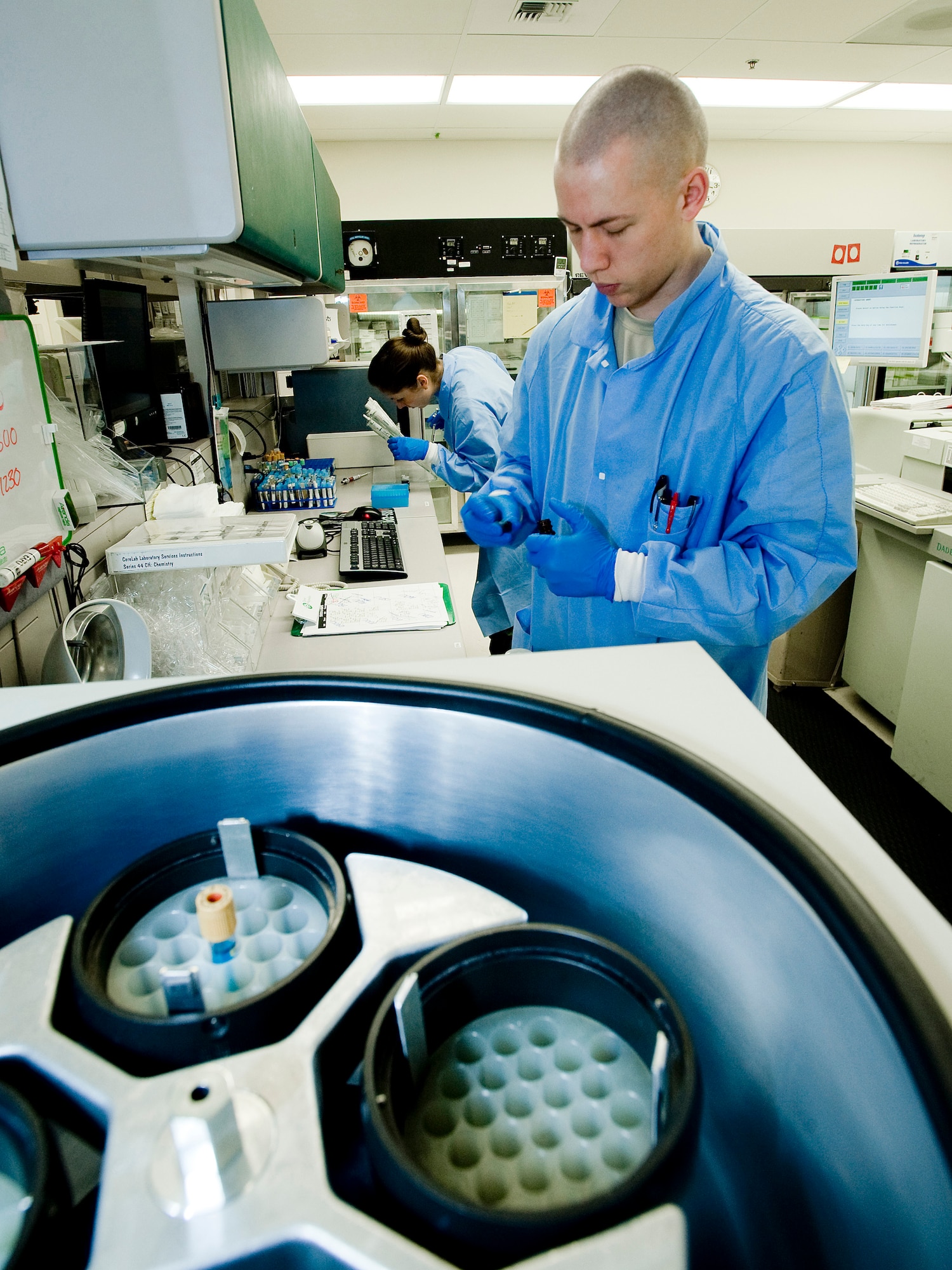 Senior Airman Adam Ponton, 3rd Medical Support Squadron, dispenses quality control samples to run on the analyzer for accurate patient results. Laboratory technicians must run the quality control procedures twice a day. (U.S. Air Force photo by Airman 1st Class Jonathan Steffen)