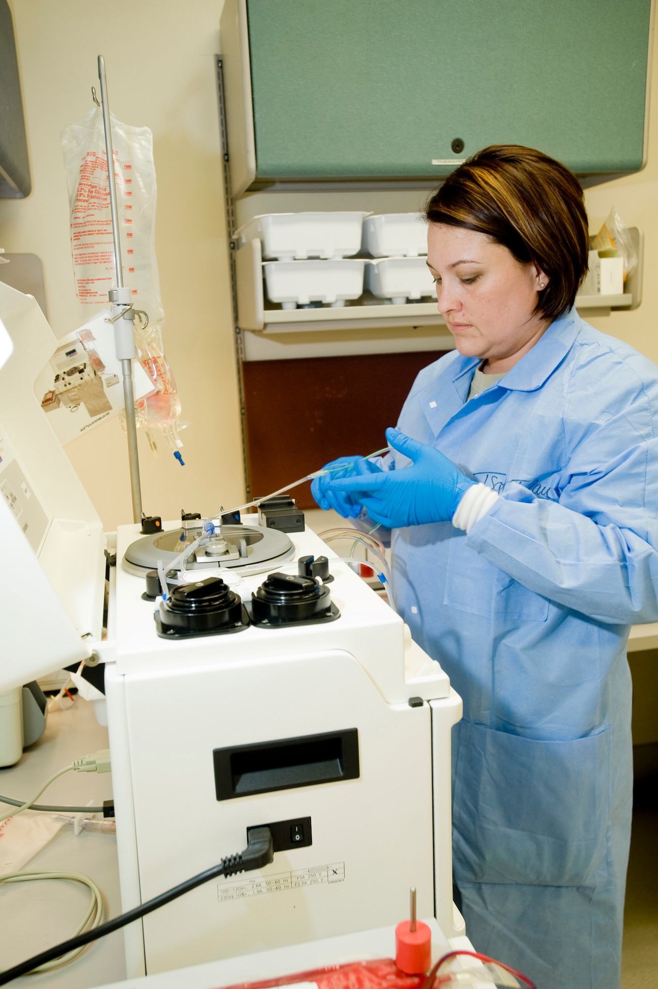 Tech. Sgt. Tonya Rau, 3rd Medical Support Squadron, processes a unit of frozen red blood cells as part of the Air Force?s Frozen Blood Program Monday. The units have to be treated before the blood cells can be transfused to a patient. (U.S. Air Force photo by Airman 1st Class Jonathan Steffen)


