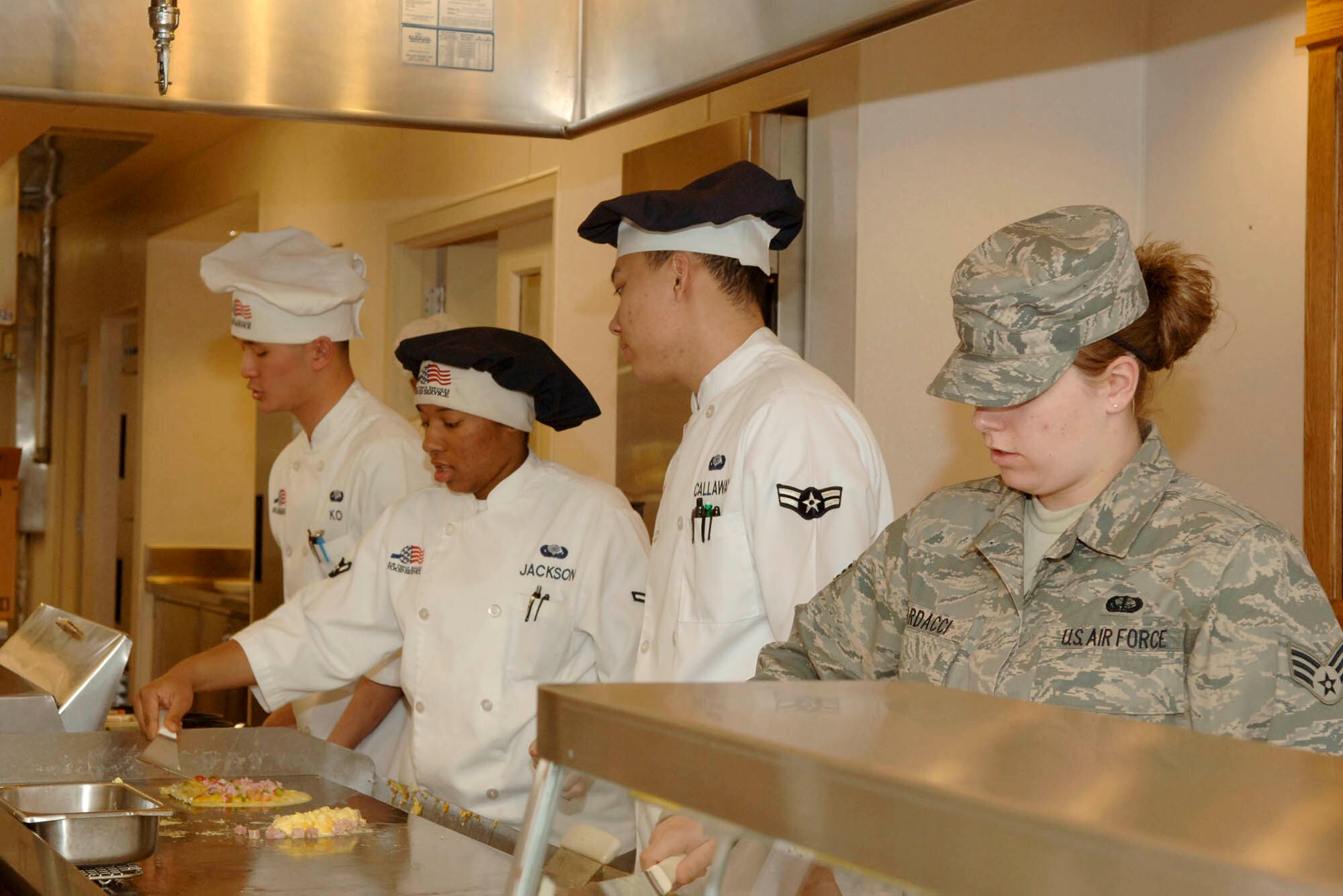 FAIRCHILD AIR FORCE BASE, Wash. – Members from the 92nd Services Squadron provide breakfast for Airmen at the Warrior Dining Facility here April 17. The services squadron was awarded the Air Mobility Command Maj. Gen. Eugene L. Eubank Award, and was visited by the Eubank Team, which evaluates services provided to the base, to compete for the award at Air Force level. The Eubank team visited Fairchild to evaluate. (U.S. Air Force photo/Airman 1st Class Darlene West)  