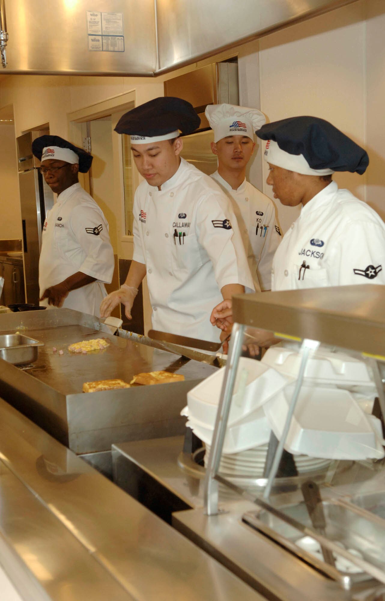 FAIRCHILD AIR FORCE BASE, Wash. – Members from the 92nd Services Squadron prepare breakfast at the Warrior Dining Facility here April 17. The services squadron was awarded the Air Mobility Command Maj. Gen. Eugene L. Eubank Award, and was visited by the Eubank Team, which evaluates and recognizes outstanding bases with sustained facilities, superior programs and customer service, to compete for the award at Air Force level. (U.S. Air Force photo/Airman 1st Class Darlene West)