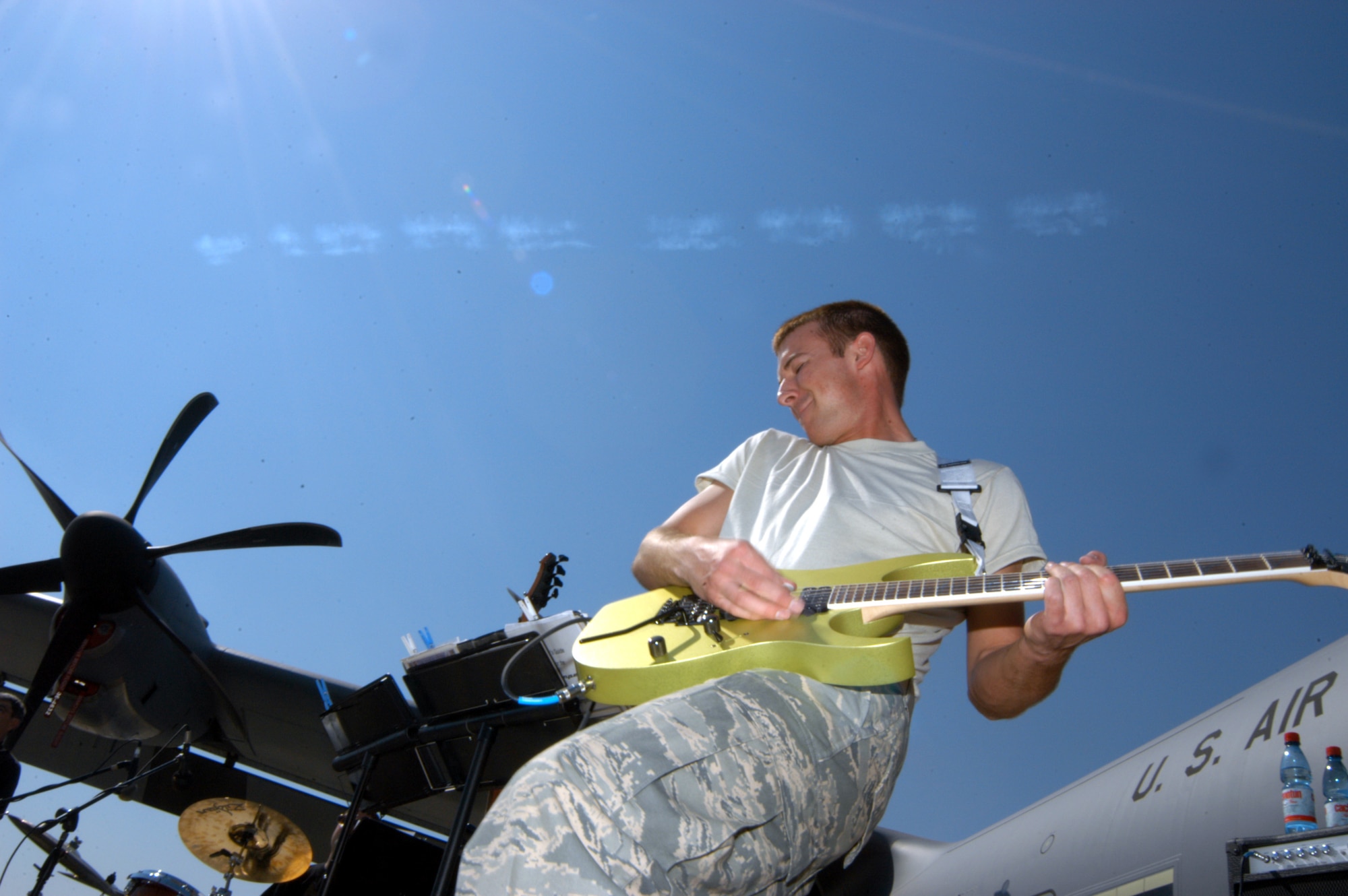 SANTIAGO, Chile -- Airman 1st Class Aaron Kusterer rips a guitar solo during a performance at FIDAE 2008 April 5.  Airman Kusterer is a member of the Air National Guard Band of the Central States.  The band as well as a host of other Airmen and aircraft were part of the South American air show and Exercise Newen 2008.  The exercise emphasizes cooperation and partnerships between the U.S. and Chilean militaries. (U.S. Air Force photo/Master Sgt. Jason Tudor)