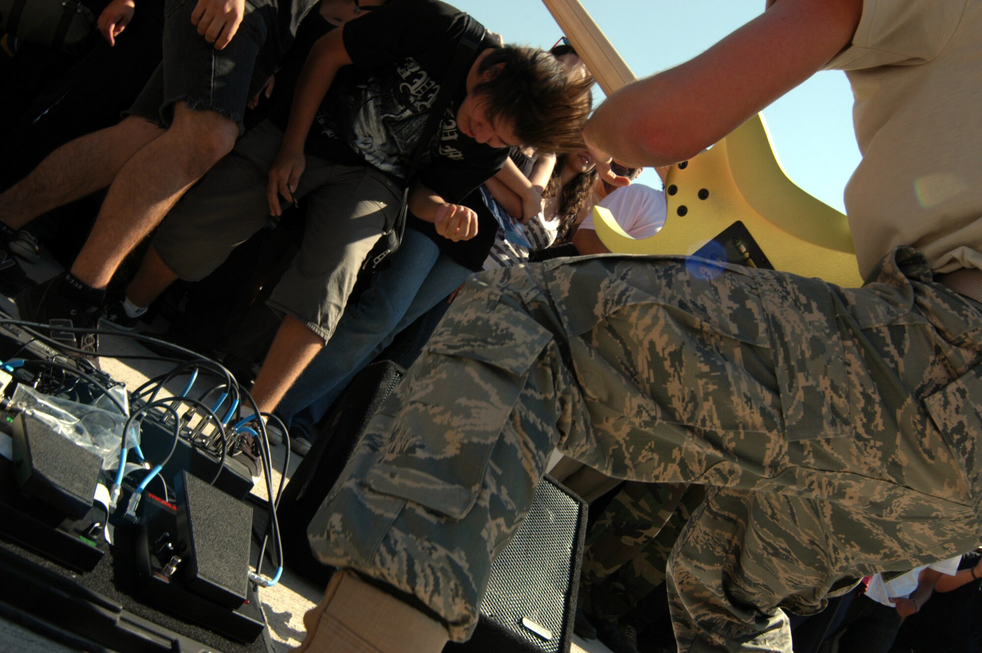 SANTIAGO, Chile -- Chilean teens rock out to the sounds of the Air National Guard Band of the Central States April 5 during a concert at FIDAE 2008.  The band as well as a host of other Airmen and aircraft were part of the South American air show and Exercise Newen 2008.  The exercise emphasizes cooperation and partnerships between the U.S. and Chilean militaries. (U.S. Air Force photo/Master Sgt. Jason Tudor)