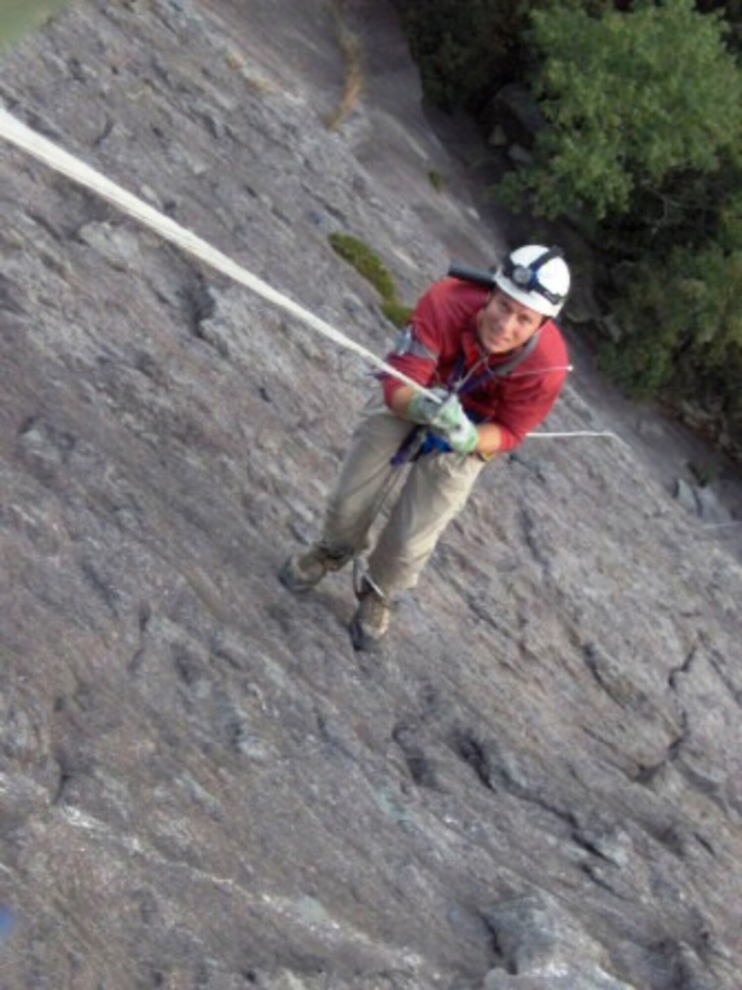 The 35-year-old engineer ascends the rope up a 700-foot rock face in Whiteside, N.C. with friend and coworker, Alan Hale (not pictured), who was teaching Watts some new skills in September 2005. (Photo provided)
