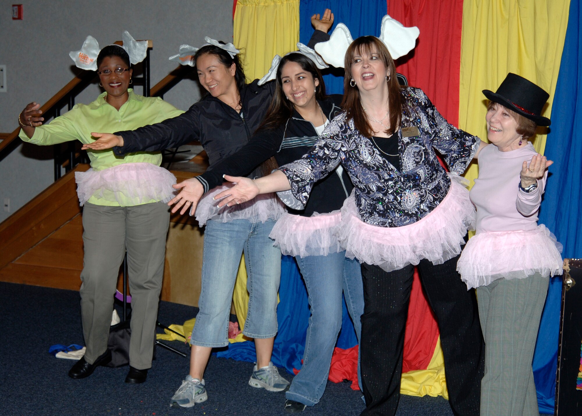 MCCONNELL AIR FORCE BASE, Kan. -- Five McConnell mothers perform a skit for their children at the base library’s open house April 15. (Photo by Airman Justin Shelton)
