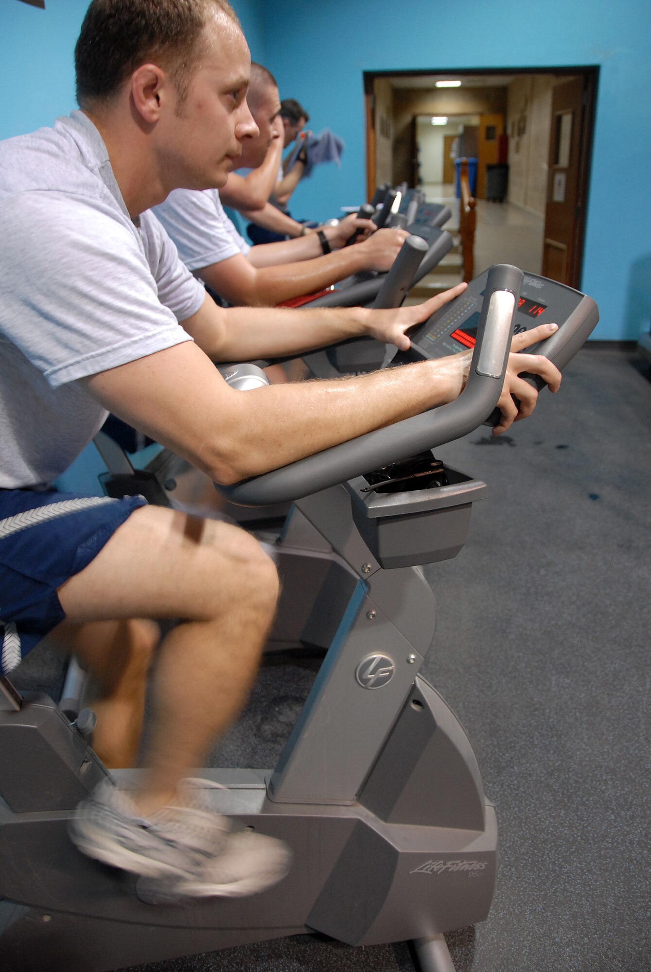 SOUTHWEST ASIA -- Senior Airman Samuel Dimmerling, 386th Expeditionary Medical Group, takes in an afternoon ride at a military fitness center April 17, 2008, in the Persian Gulf Region. Airman Dimmerling is deployed from the 79th MDG, Andrews Air Force Base, Md., supporting the Global War on Terrorism. (U.S. Air Force photo/Tech. Sgt. Michael O'Connor)