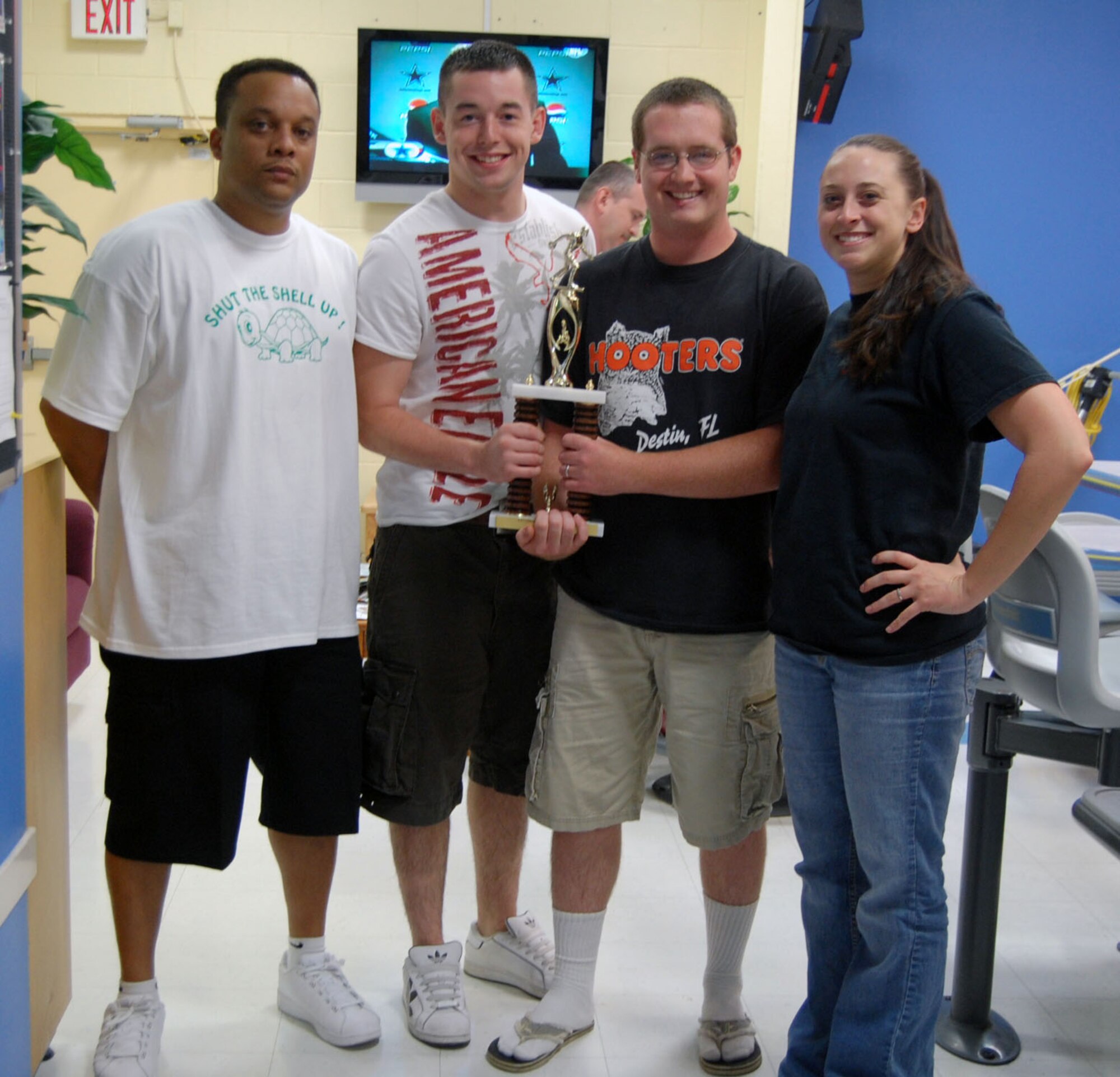 LAUGHLIN AIR FORCE BASE, Texas – The 47th Operations Support Squadron team pose with their trophy after placing third in the base bowling competition at Cactus Lanes April 10. (U.S. Air Force photo by Airman 1st Class Sara Csurilla)