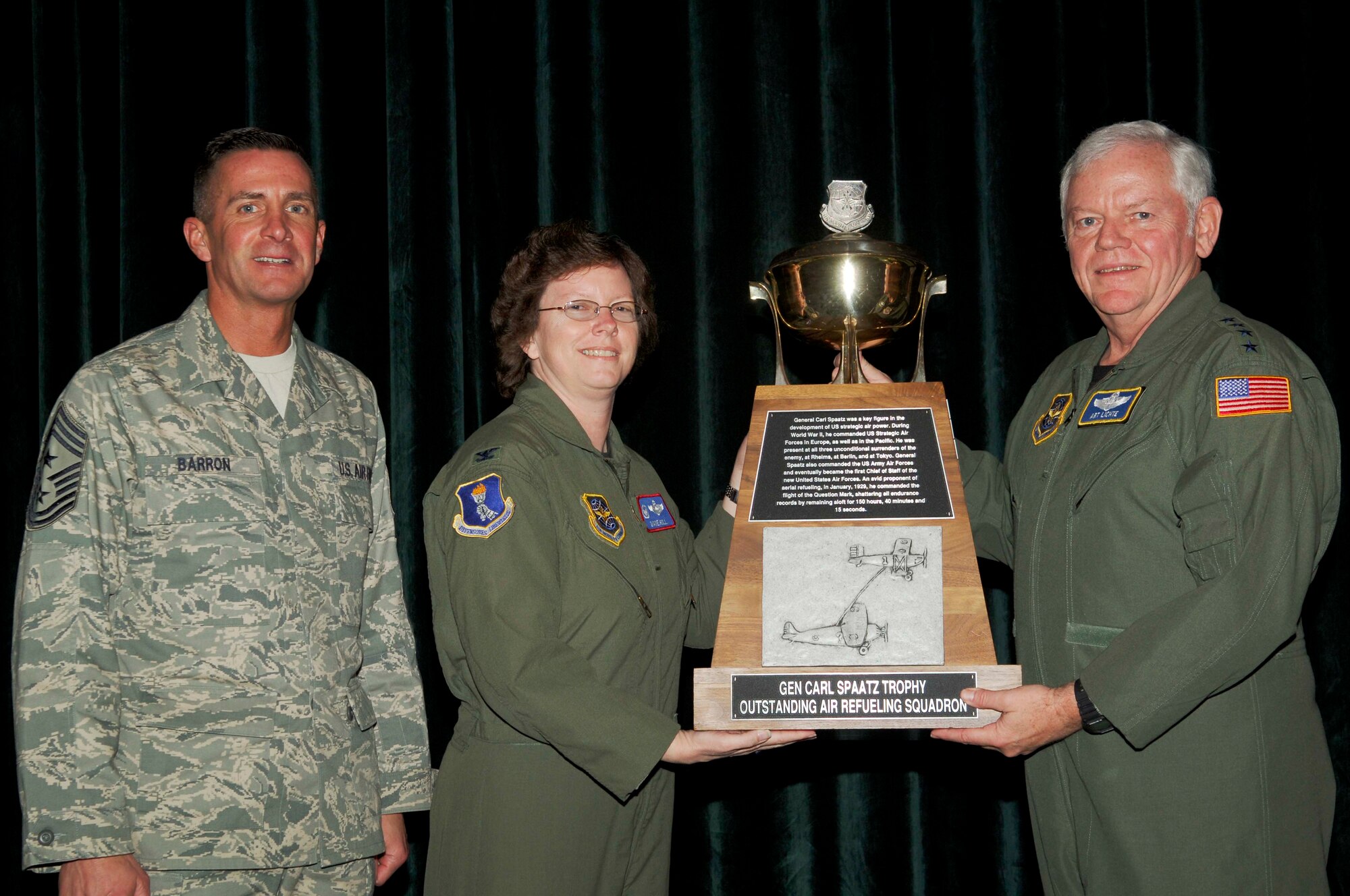 Col. Diane Hull, 319th Air Refueling Wingcommander, accepts the Gen. Carl Spaatz Award on behalf of the 912th Air Refueling Squadron from Gen. Arthur Lichte, AMC commander, along with Chief Master Sgt. Joseph Barron, AMC command chief.

