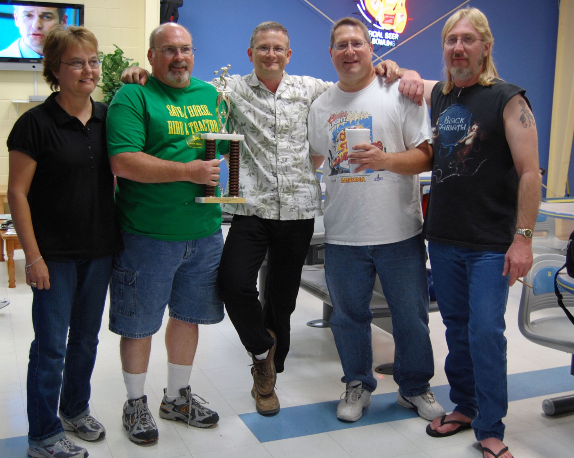 LAUGHLIN AIR FORCE BASE, Texas – The Laughlin Consolidated Services Aircraft Maintenance “number two” team pose with their trophy after taking first place in the base bowling competition at Cactus Lanes April 10. (U.S. Air Force photo by Airman 1st Class Sara Csurilla)