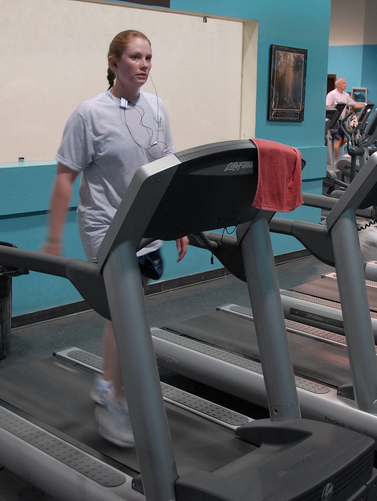 SOUTHWEST ASIA -- Staff Sgt. Rebecca Place, 386th Expeditionary Medical Group, cools down from her run on a treadmill at a military fitness center April 17, 2008, in the Persian Gulf Region. Sergeant Place is deployed from the 375th Medical Group, Scott Air Force Base, Ill., supporting the Global War on Terrorism. (U.S. Air Force photo/Tech. Sgt. Michael O'Connor)