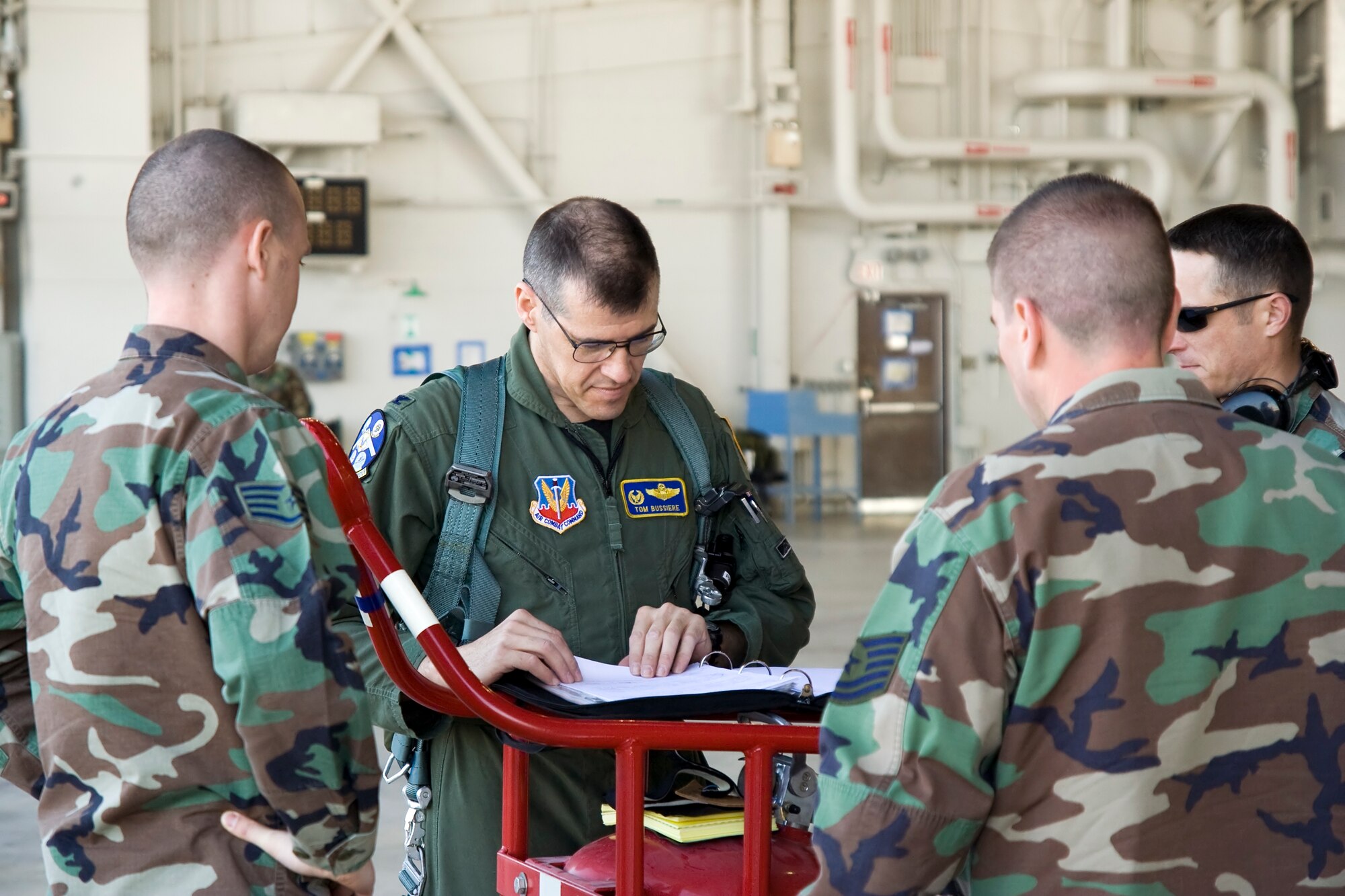 WHITEMAN AIR FORCE BASE, Mo. - Col. Tom Bussiere, 509th Operations Group commander, reviews aircraft forms with maintainers prior to flying the Spirit of Florida April 15. The flight was the first since the B-2’s crash at Andersen Air Force Base, Guam, Feb. 23. (U.S. Air Force photo/Capt. Allen Clark)

