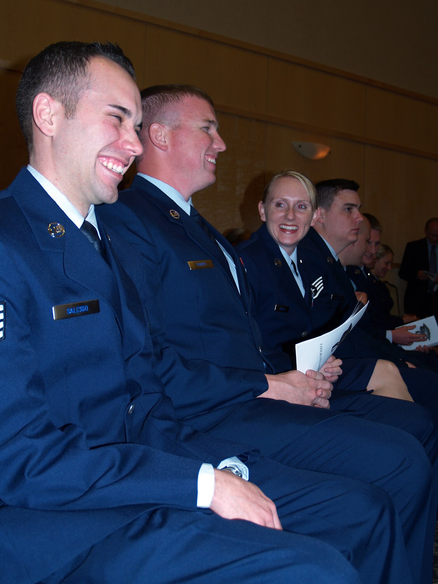 Staff Sgt. David Salcido, Tech. Sgt. Jason Thorpe, and Tech. Sgt. Joni Hadley chat before the Community College of the Air Force graduation ceremony begins Tuesday. The 419th Fighter Wing had 17 graduates this semester. 