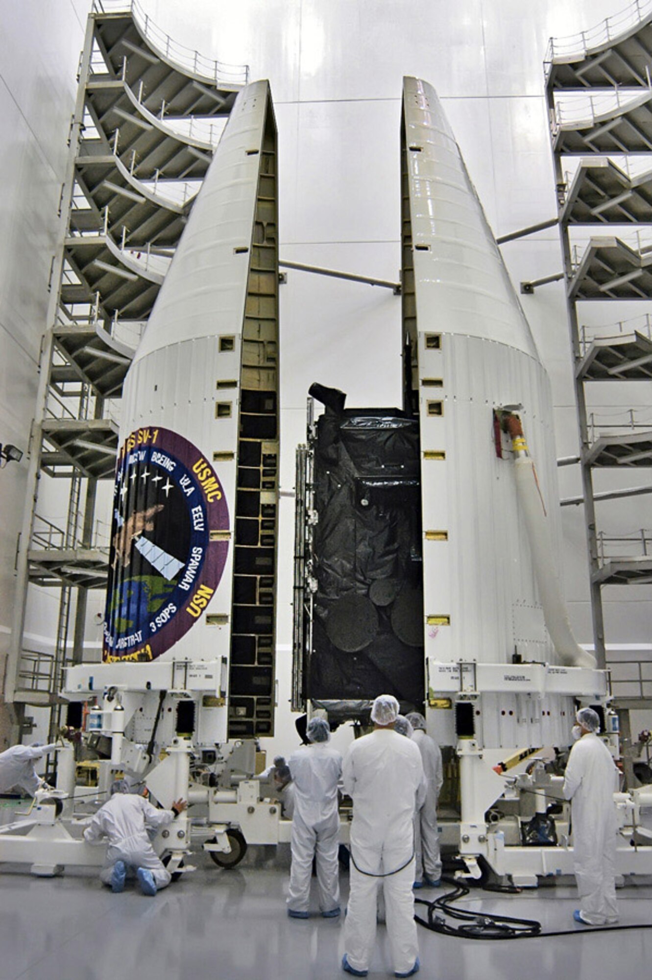 Assembly of the Wideband Global SATCOM Satellite took place at Boeing corporation facilities in California. Here, the satellite is being enclosed within the nosecone of the rocket that carried it into orbit. (Photo courtesy) 

