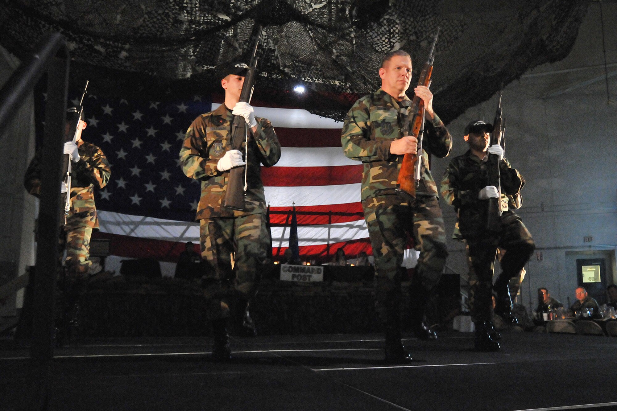 Chief Master Sgt. Steve Sargent performs a routine with the drill team at the Enlisted Dining Out April 11. This year's Enlisted Dining Out focused on "Transforming the Warrior Airman" and highlighted the Air Force's traditions over the past years. (U.S. Air Force photo/John Turner)