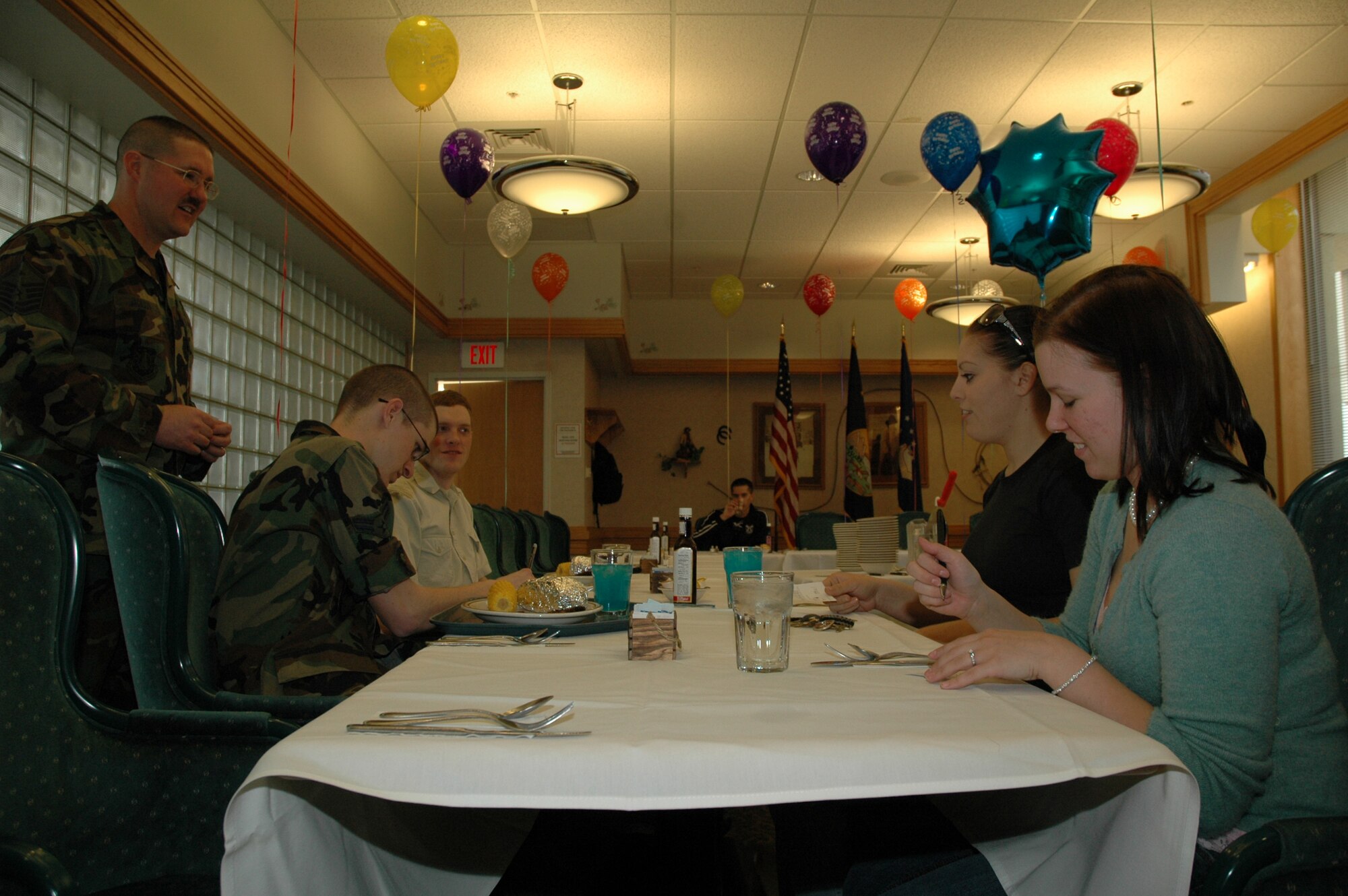 Master Sgt. James Jackson, 341st Logistics Readiness Squadron first sergeant, waits to take orders from Airmen 1st Class Thomas Crawford and Jennifer Sumner, 341st LRS, Airman 1st Class Alicia Penate, 341st Civil Engineer Squadron, and Senior Airman Tyler Trate, 341st Services Squadron, at the Elkhorn Diner's Birthday Dinner, April 10. The Birthday Dinner is held bi-annually. First sergeants take orders and serve their airmen, and cake is provided. (U.S. Air Force photo/Airman 1st Class Emerald Ralston)