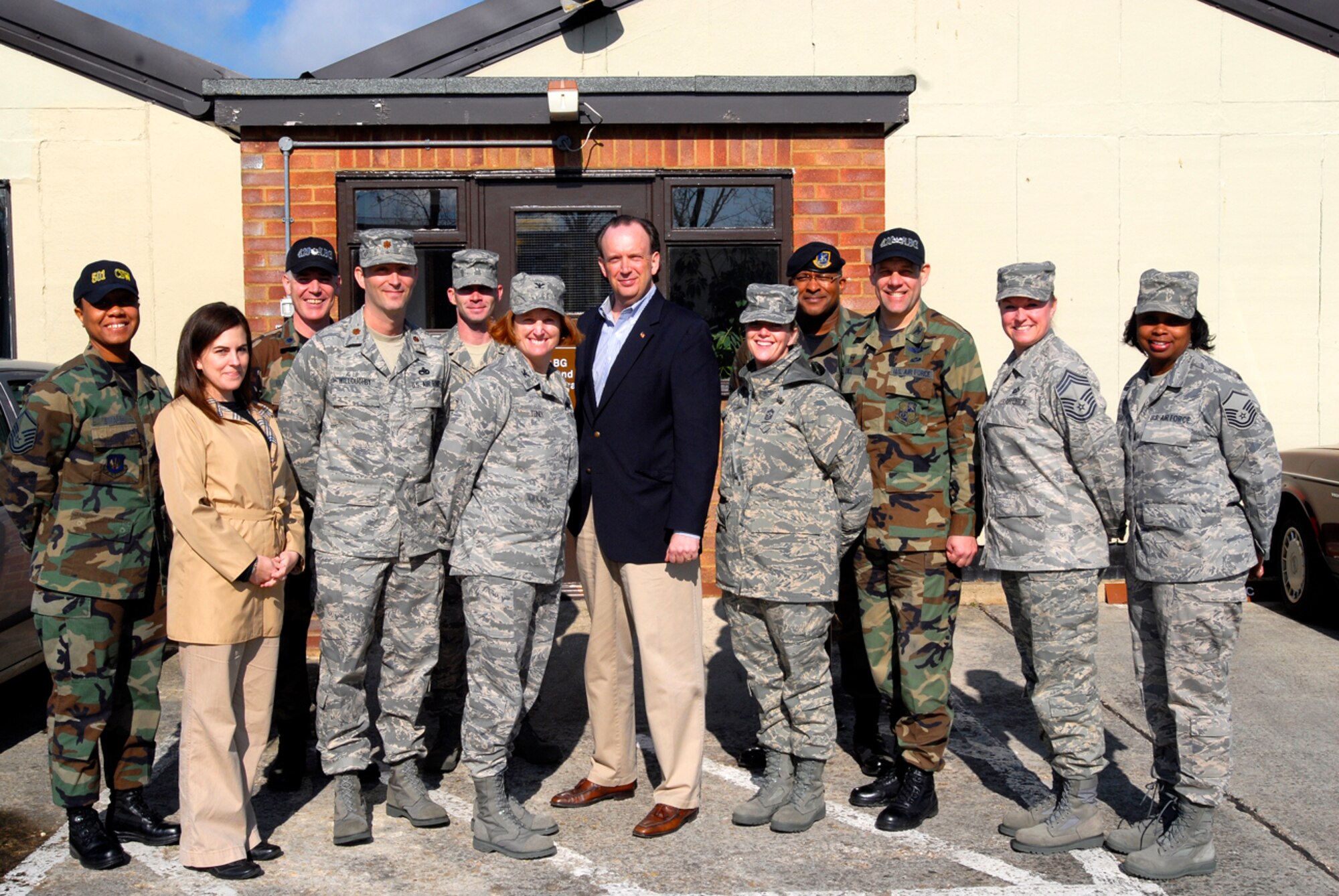 Mr. William Anderson, Assistant Secretary of the Air Force for Information, Environment, and Logistics (center), stands with Col. Kimberly Toney, 501st Combat Support Wing commander, and members of Team Fairford. Mr. Anderson visited RAF Fairford April 7.