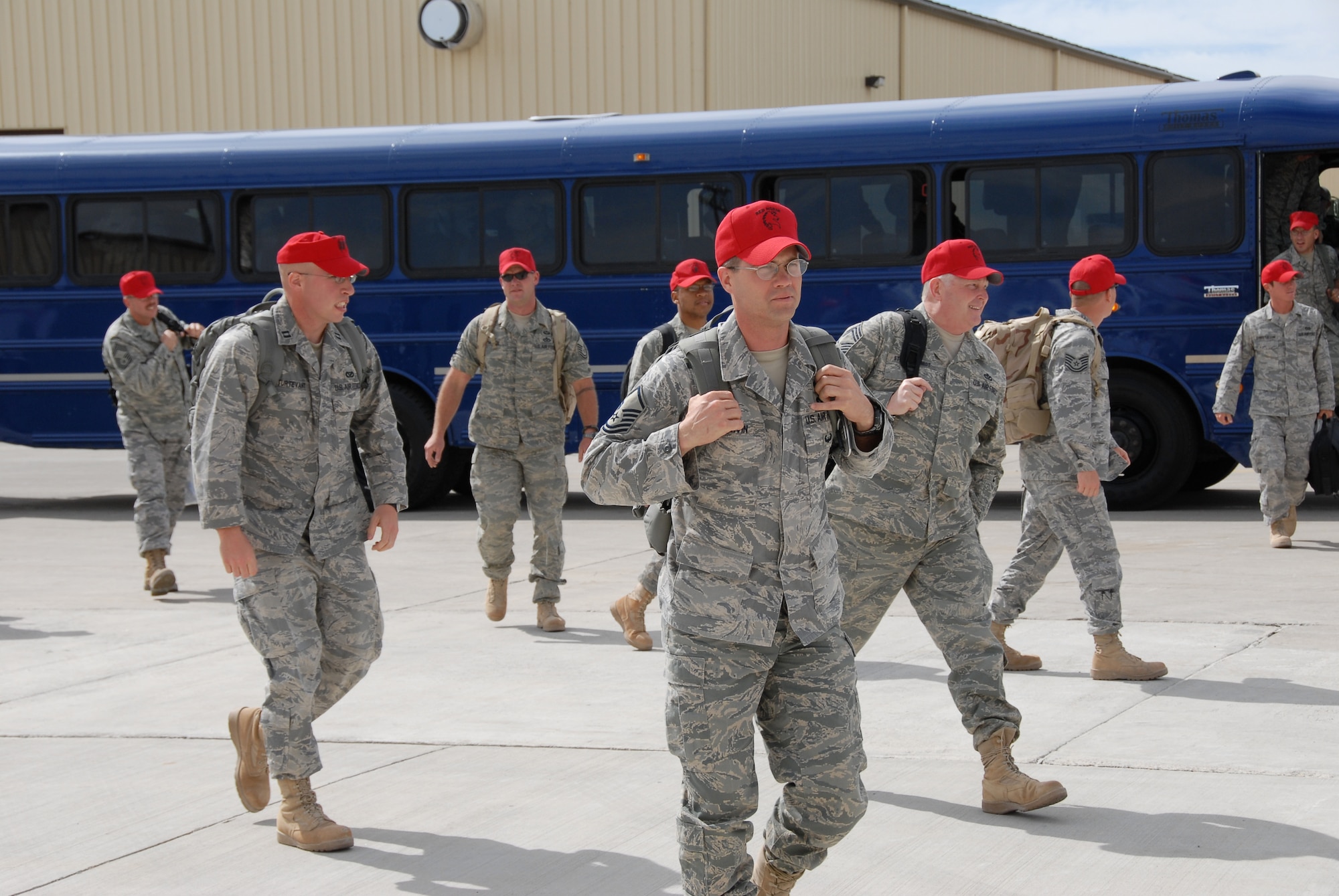 Members of the 819th RED HORSE Squadron return from a six-month deployment in support of the Global War on Terrorism. They were welcomed by friends and family members at the RED HORSE Hangar at Malmstrom April 14. (U.S. Air Force photo/John Turner)
