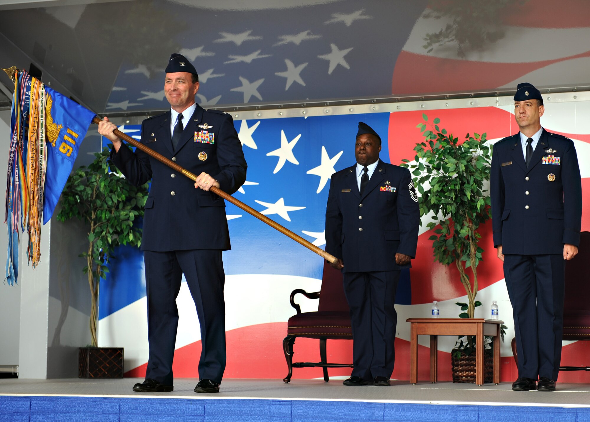 Colonel Jon Klaus, Commander of the 6th Operations Group at MacDill AFB, Fla. activates the 911th Air Refueling Squadron on Saturday April 12, 2008. Lt. Col. Bill Uptmor, right, assumed command of the squadron at its new home, Seymour Johnson AFB, N.C. CMSgt Garry Seay, center, is the squadron's maintenance superintendent.

(US Air Force photo by Airman First Class Salma Din)(Released)