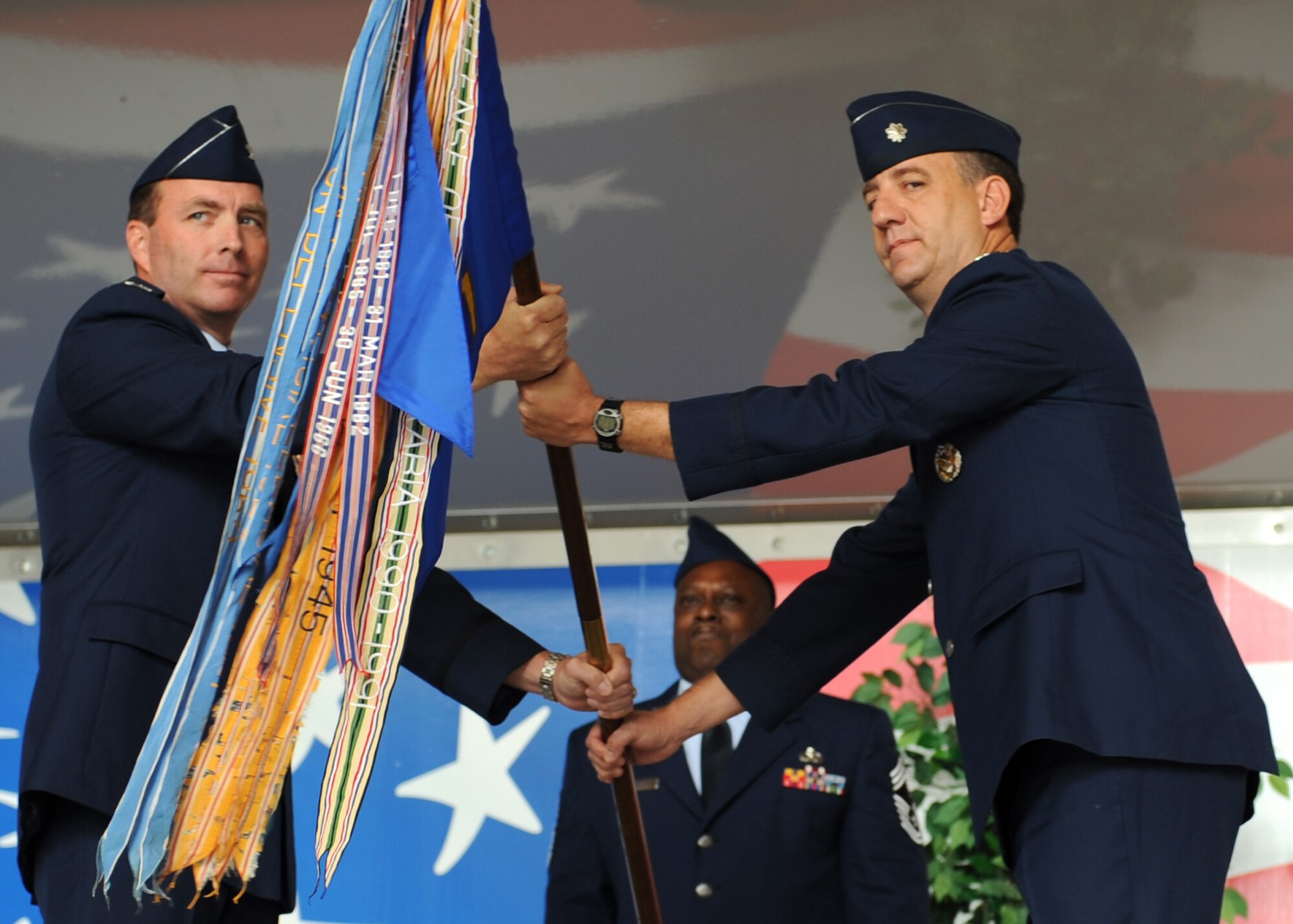 Colonel Jon Klaus, Commander of the 6th Operations Group at MacDill AFB, Fla. activates the 911th Air Refueling Squadron on Saturday April 12, 2008. Lt. Col. Bill Uptmor, right, assumed command of the squadron at its new home, Seymour Johnson AFB, N.C. CMSgt Garry Seay, center, is the squadron's maintenance superintendent.

(US Air Force photo by Airman First Class Salma Din)(Released)