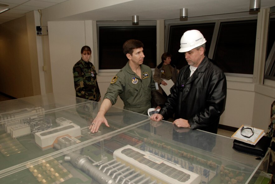 General Lanni asks questions about the Aeropropulsion Systems Test Facility (ASTF) to Mark Grantham. (Photo by Rick Goodfriend)