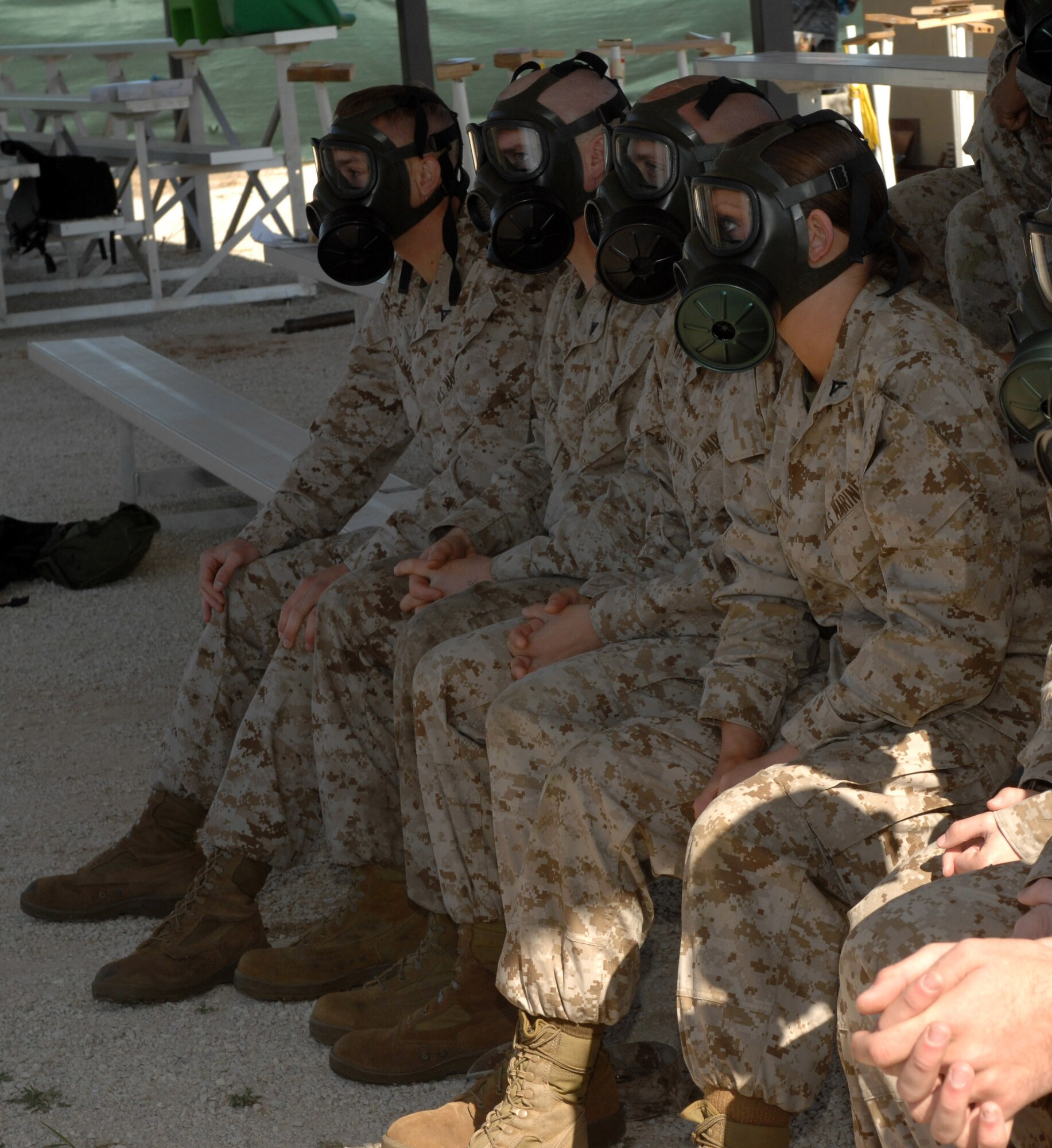 DYESS AIR FORCE BASE, Texas- Marines from Detachment one, wait for more instructions on the use and wear of the gas mask, April 12. Marines have annual chemical warfare training to maintain an active deployment status. (U.S. Air Force photo by Senior Airman Courtney Richardson)