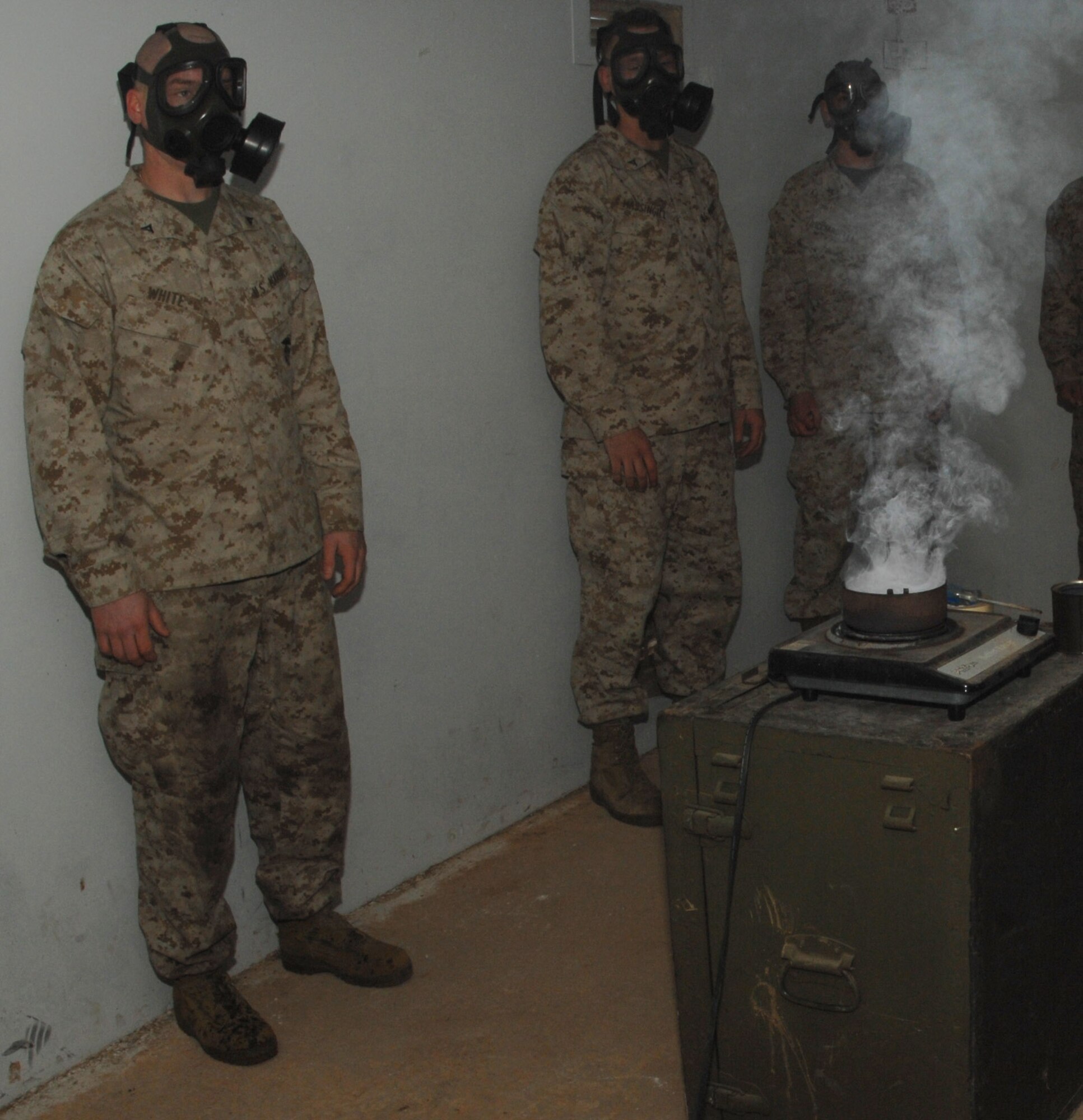 DYESS AIR FORCE BASE, Texas- Lance Corporal James White, Detachment 1, waits for further instructions in the gas chamber, April 12. Once inside the chamber, service members are exposed to tear gas. (U.S. Air Force photo by Senior Airman Courtney Richardson)