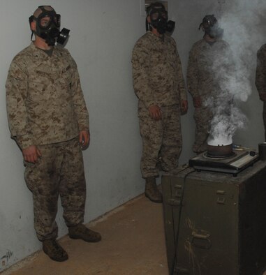 DYESS AIR FORCE BASE, Texas - Lance Corporal James White, Detachment 1, waits for further instructions in the gas chamber, April 12. Once inside the chamber, service members are exposed to tear gas. (U.S. Air Force photo by Senior Airman Courtney Richardson)