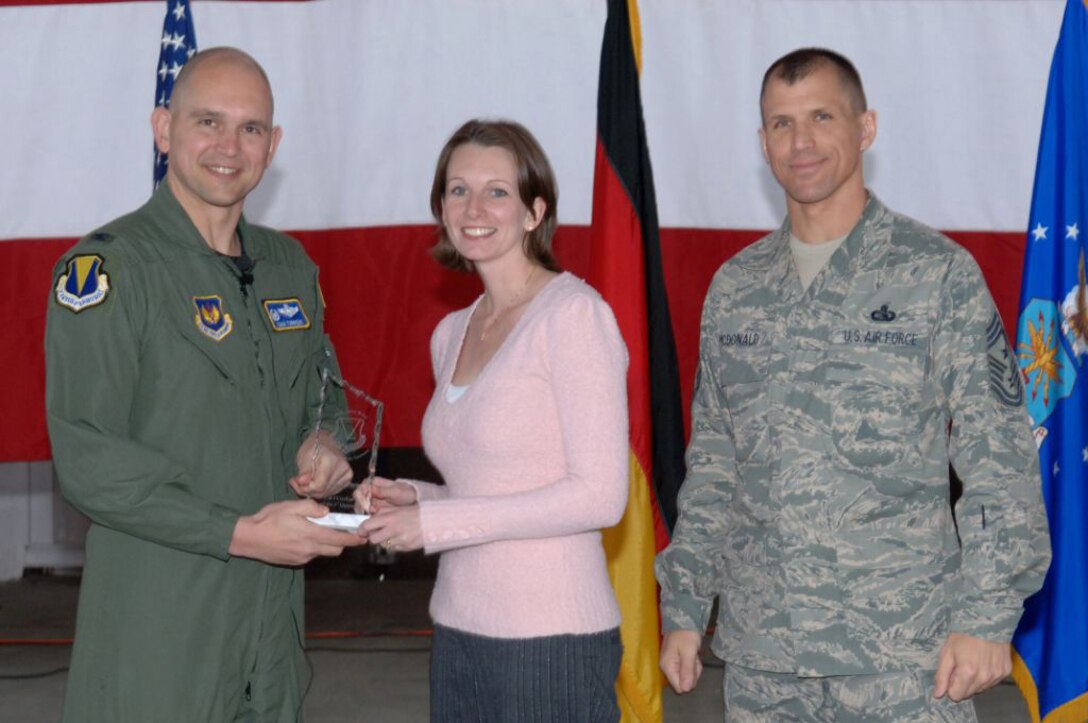 Jessica Payne, 1st Air and Space Communications Squadron, was awarded the 86th Airlift Wing Civilian (Cat I) of the Quarter, April 16 by Col. Cam Torrens, 86th Airlift Wing vice commander, and Chief Master Sgt. Steve McDonald, 86th AW command chief. (U.S. Air Force photo by Airman 1st Class Tony Ritter)
