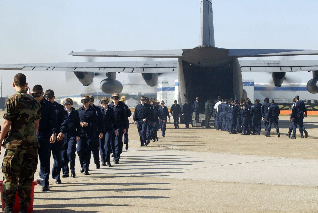 Junior Reserve Officer Training Corps cadets depart from one side and load onto another side of a C-130 used for orientation flights provided by the 94th Airlift Wing as a part of  a program to provide information about the Air Force Reserve Program to area cadets. Nearly 1,500 students flew during the two-day event. (Air Force photo/Don Peek)