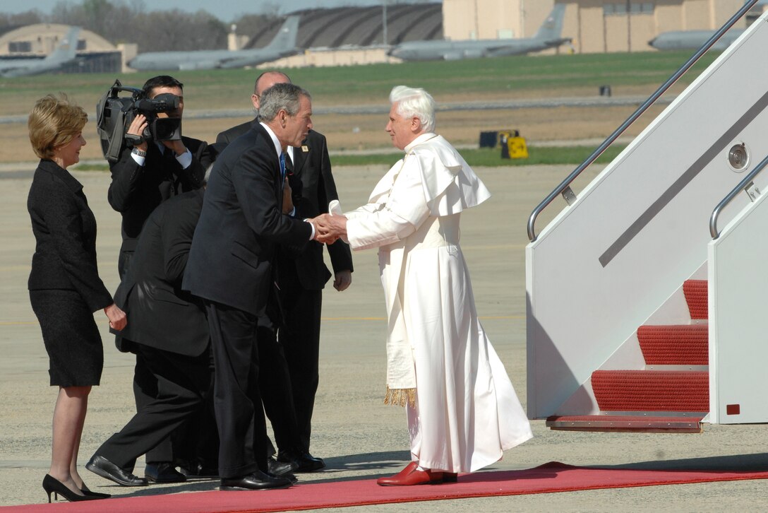 President George W. Bush greets Pope Benedict XVI upon his arrival at Andrews Air Force Base, Md., hosted by the 316th Wing and the Air Force District of Washington,  on April 15th, 2008, beginning his weeklong trip to the United States.  The Pontiff, selected 265th pope on April 19, 2005, will meet with President George W. Bush at the White House, address the Presidents of Roman Catholic Colleges and Universities, and celebrate mass at Nationals Park in Washington D.C. and Yankee Stadium in New York City.  (U.S. Air Force photo by Tech Sgt. Craig Clapper)
