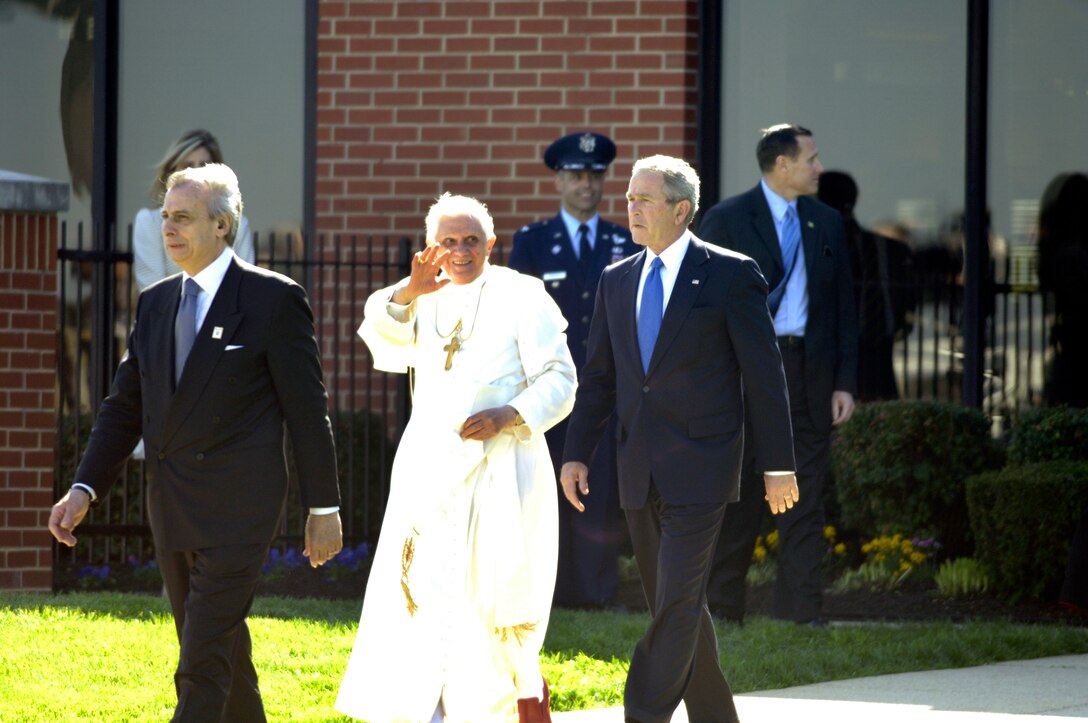 Pope Benedict XVI walks with President George W. Bush upon his arrival at Andrews Air Force Base, Md., hosted by the 316th Wing and the Air Force District of Washington,  Apr 15, 2008, beginning his weeklong trip to the United States.  The Pontiff, selected 265th pope on April 15, 2008, will meet with President George W. Bush at the White House, address the presidents of Roman Catholic Colleges and Universities, and hold mass at Nationals Park in Washington D.C. and Yankee Stadium in New York City.
   (U.S. Air Force photo by Senior Airman Renae L. Kleckner)(released)