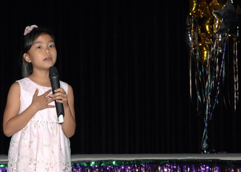 Rynelle Acasio sings "Somewhere Over the Rainbow" by Harold Arlen, during the 2008 United States Air Forces in Europe Youth Talent Contest April 10 at the Incirlik Consolidated Club. Rynelle won first place Female Vocalist and Best in Show for the 6-11 age group. (U.S. Air Force photo by Senior Airman Jason Burton)