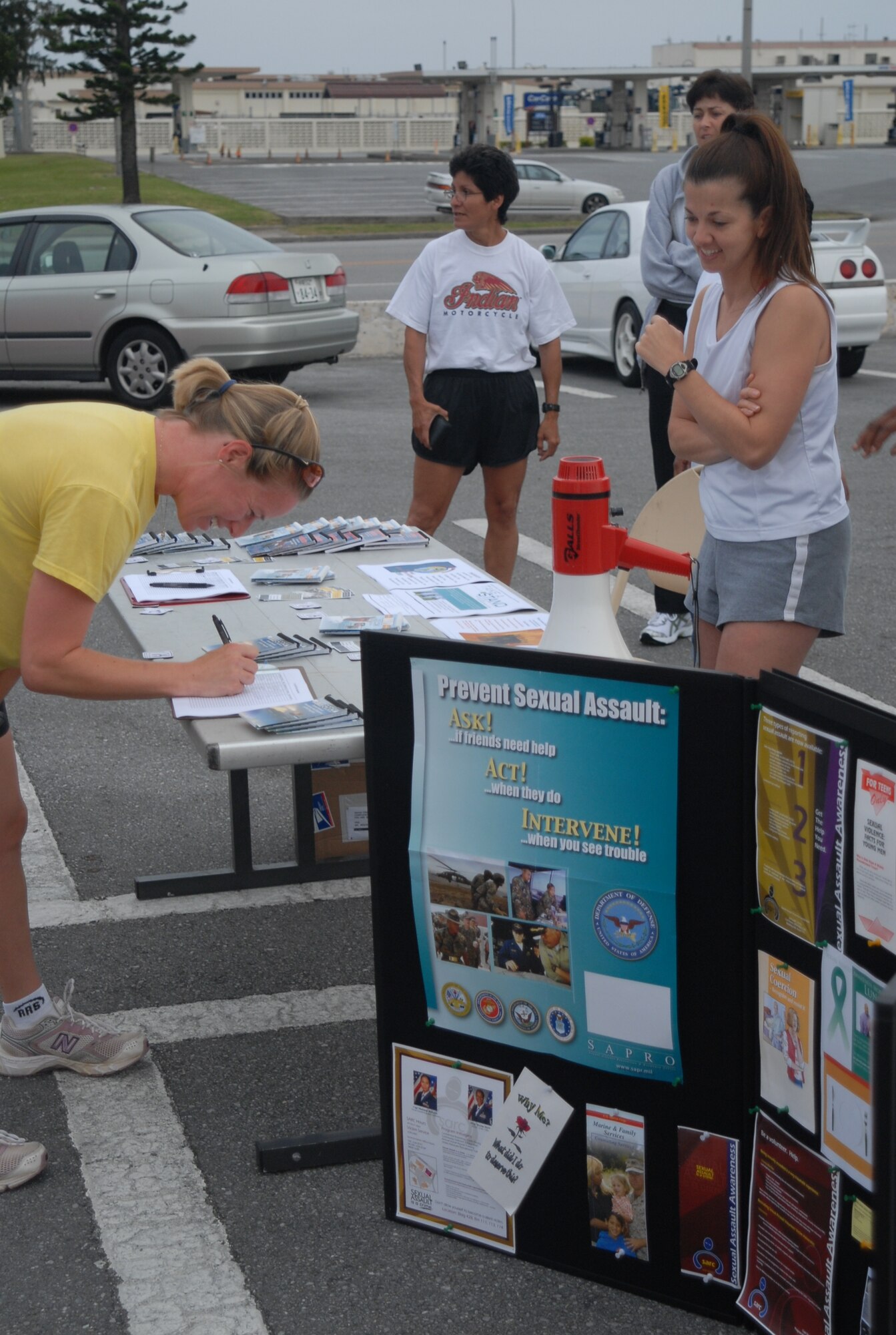 Individuals from around Okinawa sign up to participate in the Kadena Sexual Assault Awareness Month 5K run/walk April 12.  The run was one of many events scheduled by the area Sexual Assault Response Coordinators to raise awareness throughout the month.  (U.S. Air Force photo/Staff Sgt. Christopher Marasky)