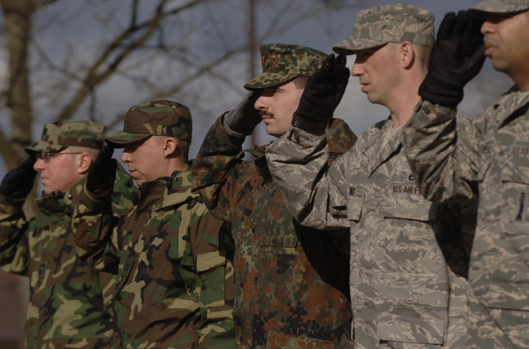 German Air Force Master Sgt. Holger Fels stands with Kisling Noncommissioned Officer Academy instructors during a retreat ceremony at Kapaun Air Station, Germany. Sergeant Fels, a German NCO Academy instructor in Appen, Germany, voluntarily enrolled in the six-week academy course designed for U.S. Air Force technical sergeants to prepare for a four-year special duty assignment as an exchange instructor at the Senior NCO Academy at Maxwell Air Force Base, Alabama. Photo by Master Sgt. Scott Wagers 